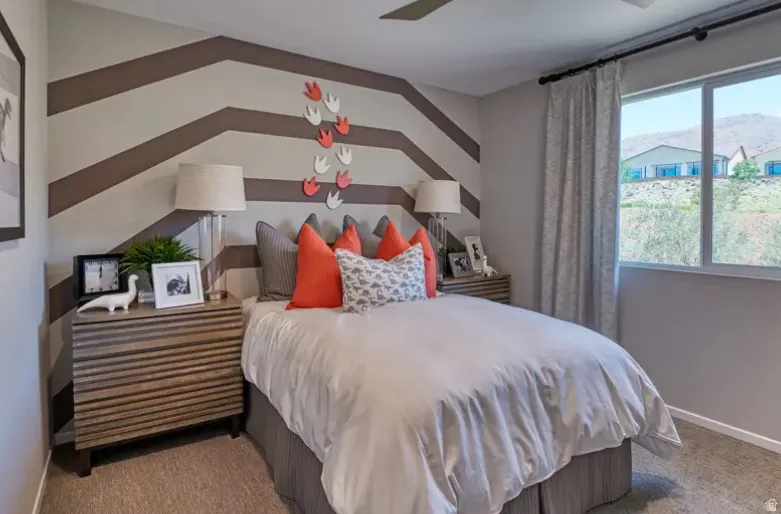 Carpeted bedroom. Pictures are of a model home only! This home may feature different finishes than what is pictured.