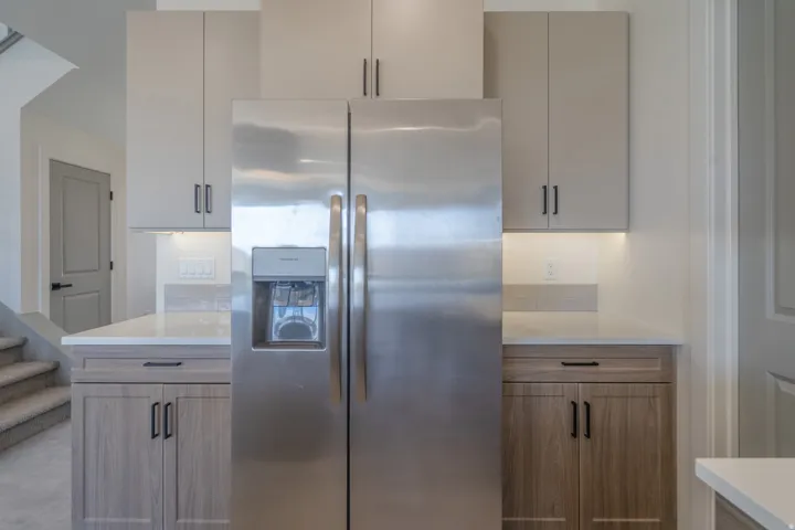 Stainless steel refrigerator with a built-in ice and water dispenser