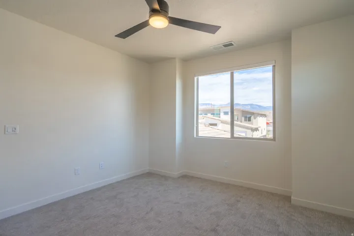 Neutral tone wall paint with a window offering distant mountain scenery