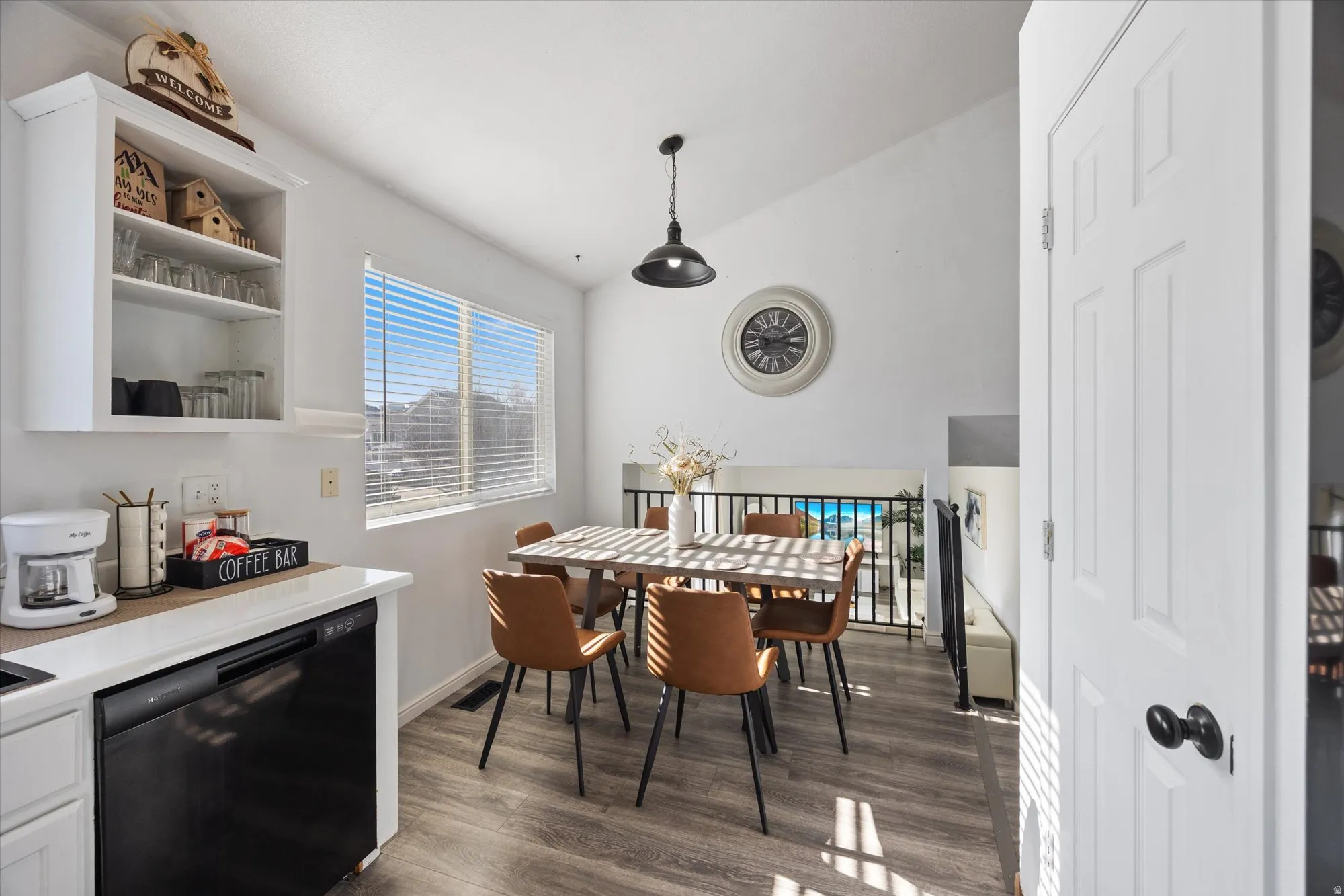 Dining space featuring lofted ceiling and dark wood finished floors