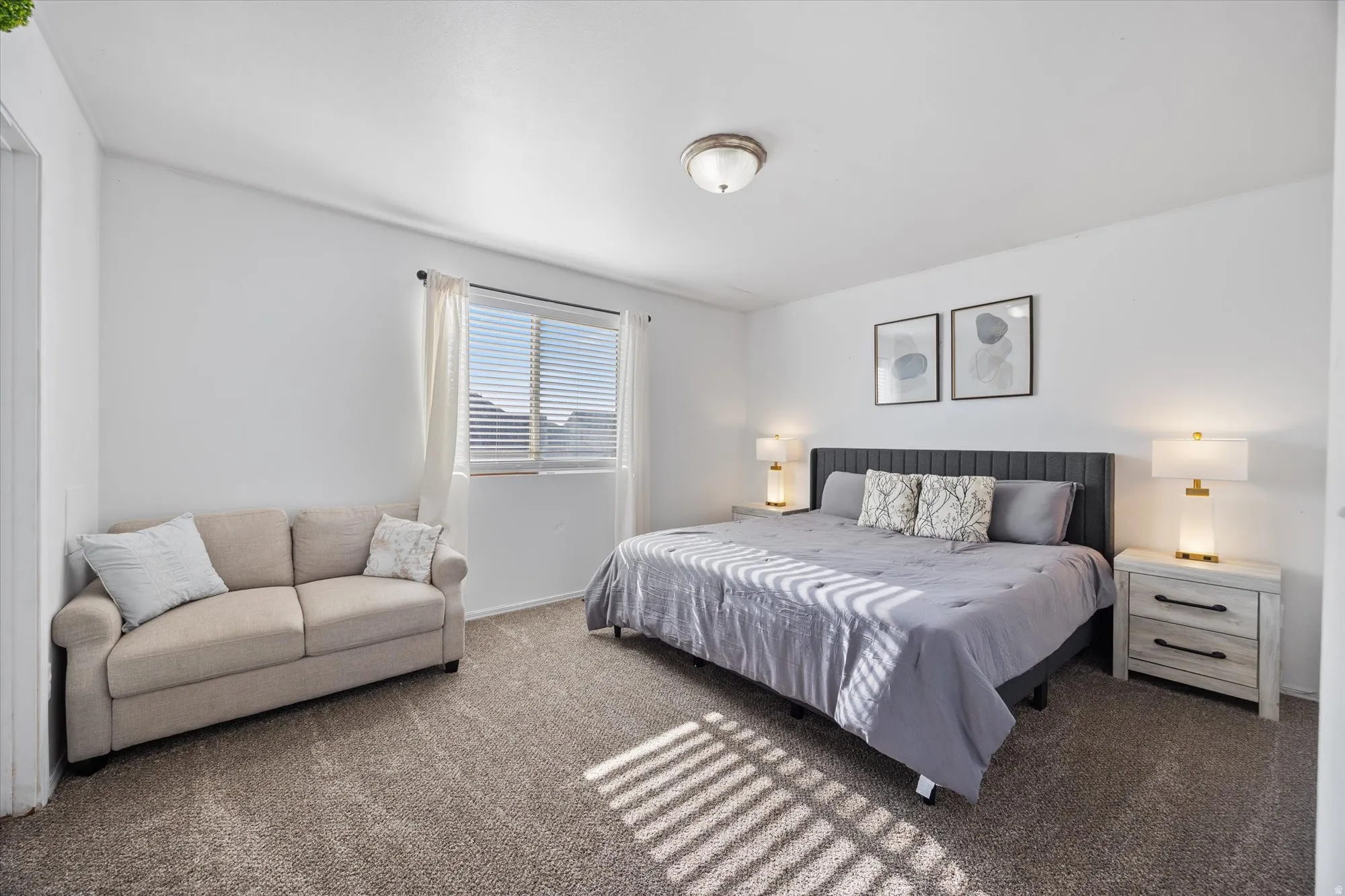 Bedroom featuring dark colored carpet