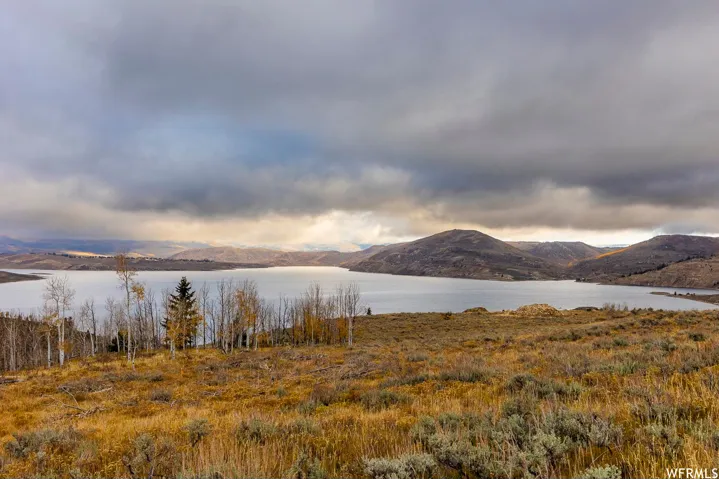 Mountain view featuring a nearby body of water