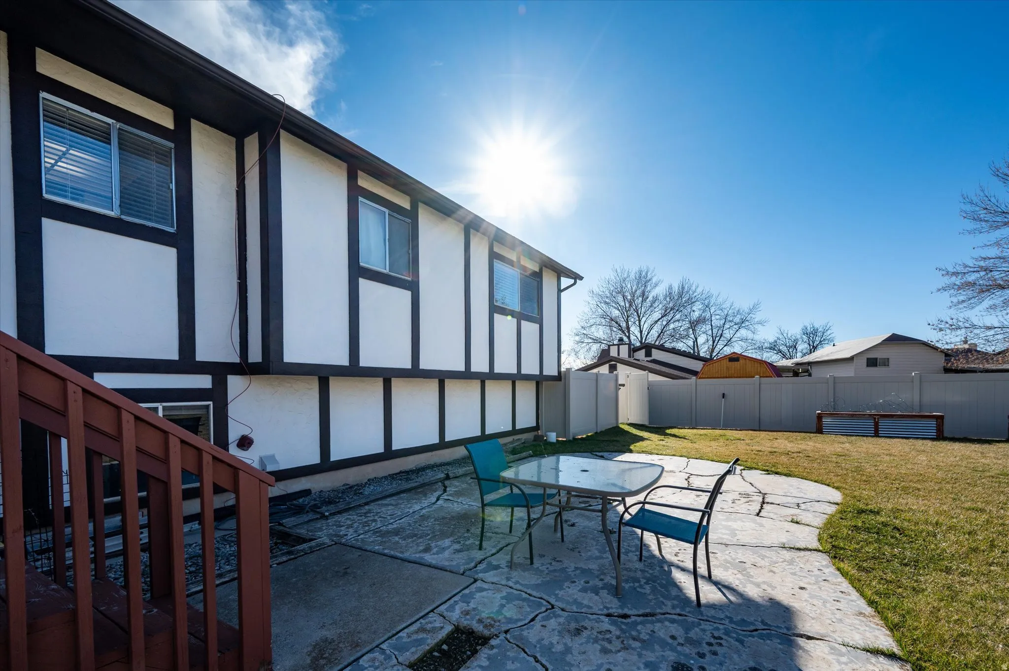 Fenced backyard with a patio area and outdoor dining space