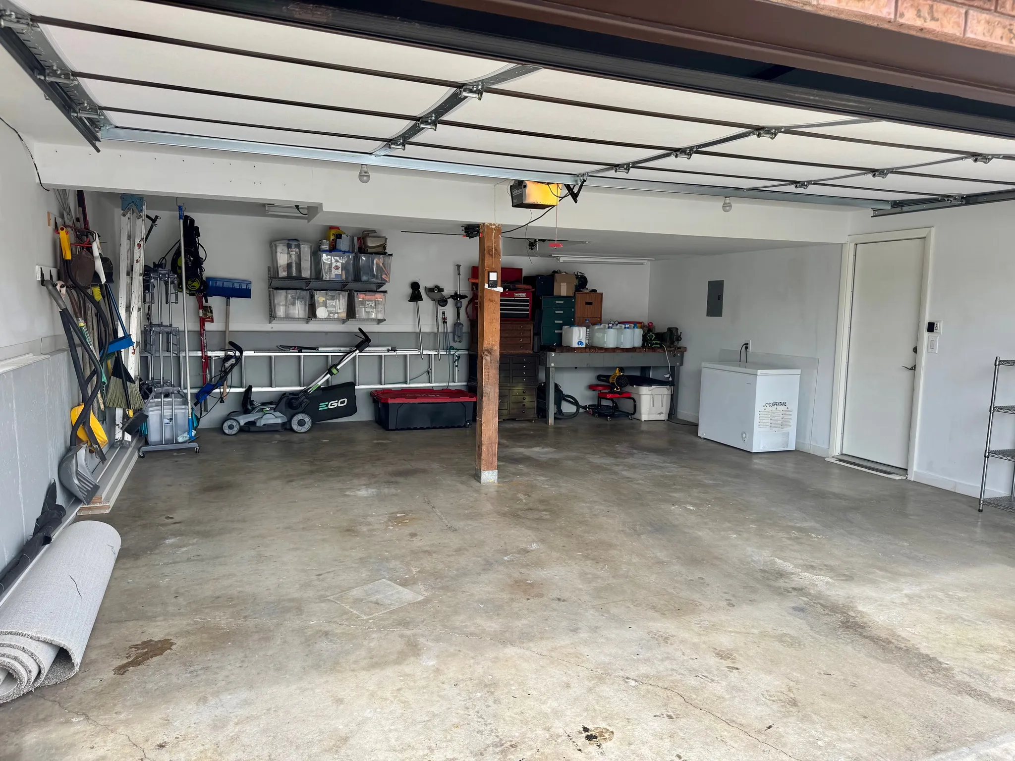 Garage featuring a garage door opener