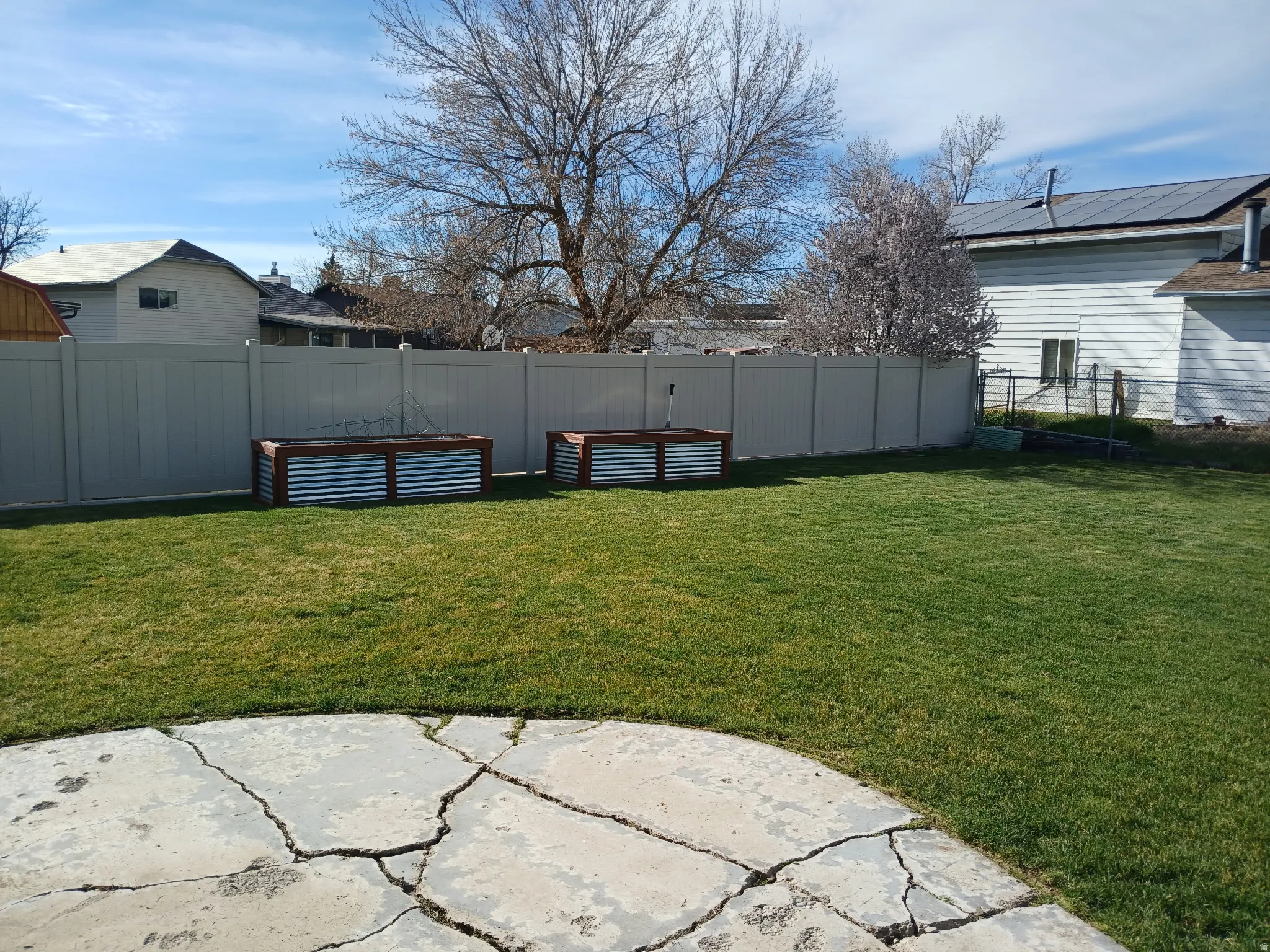View of fenced backyard