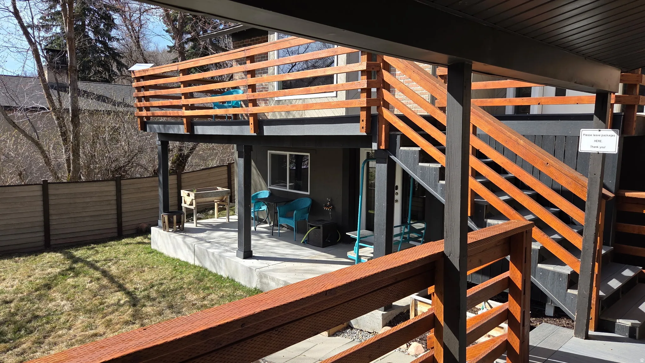 Wooden deck featuring a patio area and stairway