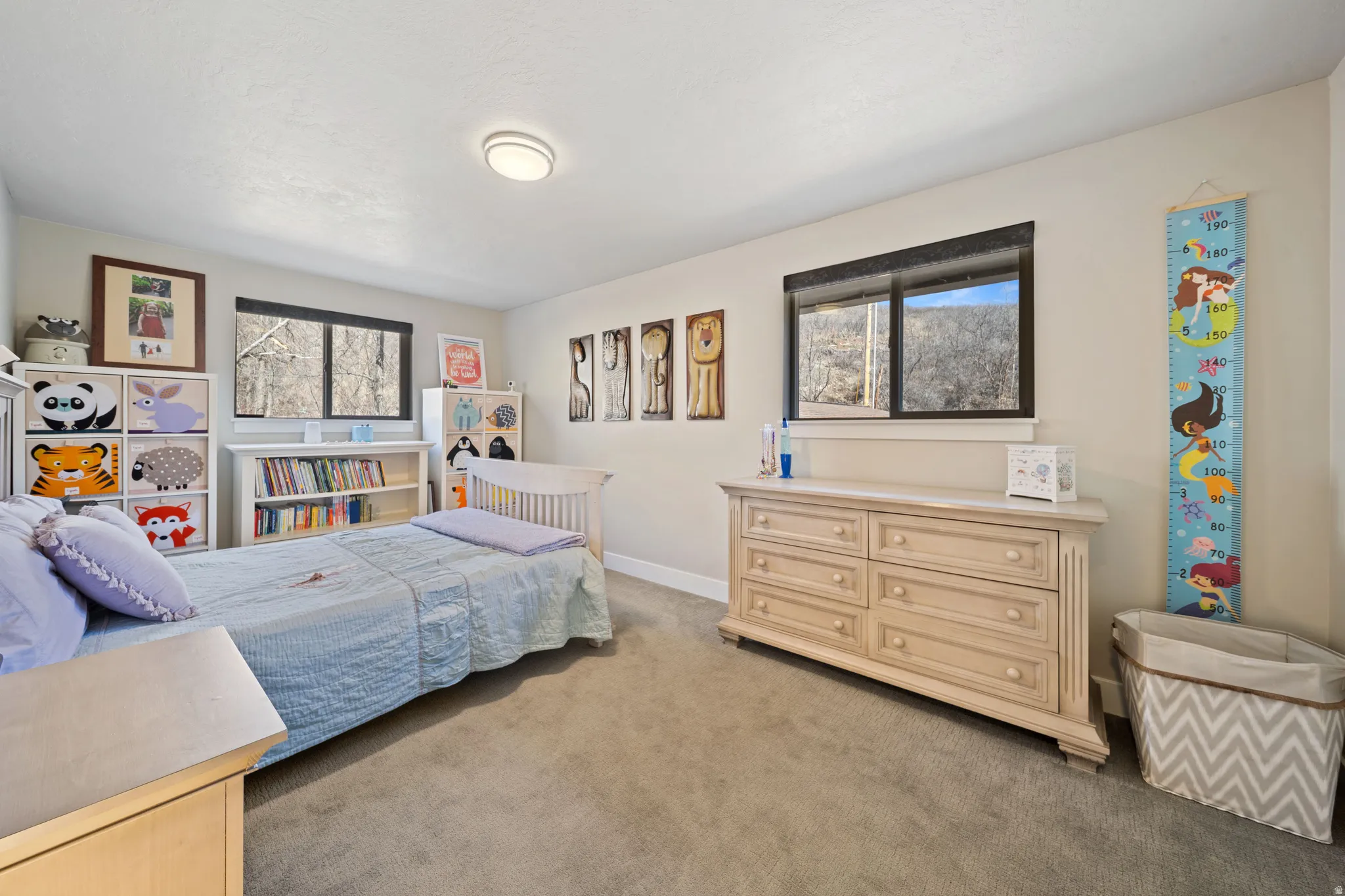 Bedroom featuring light colored carpet and baseboards