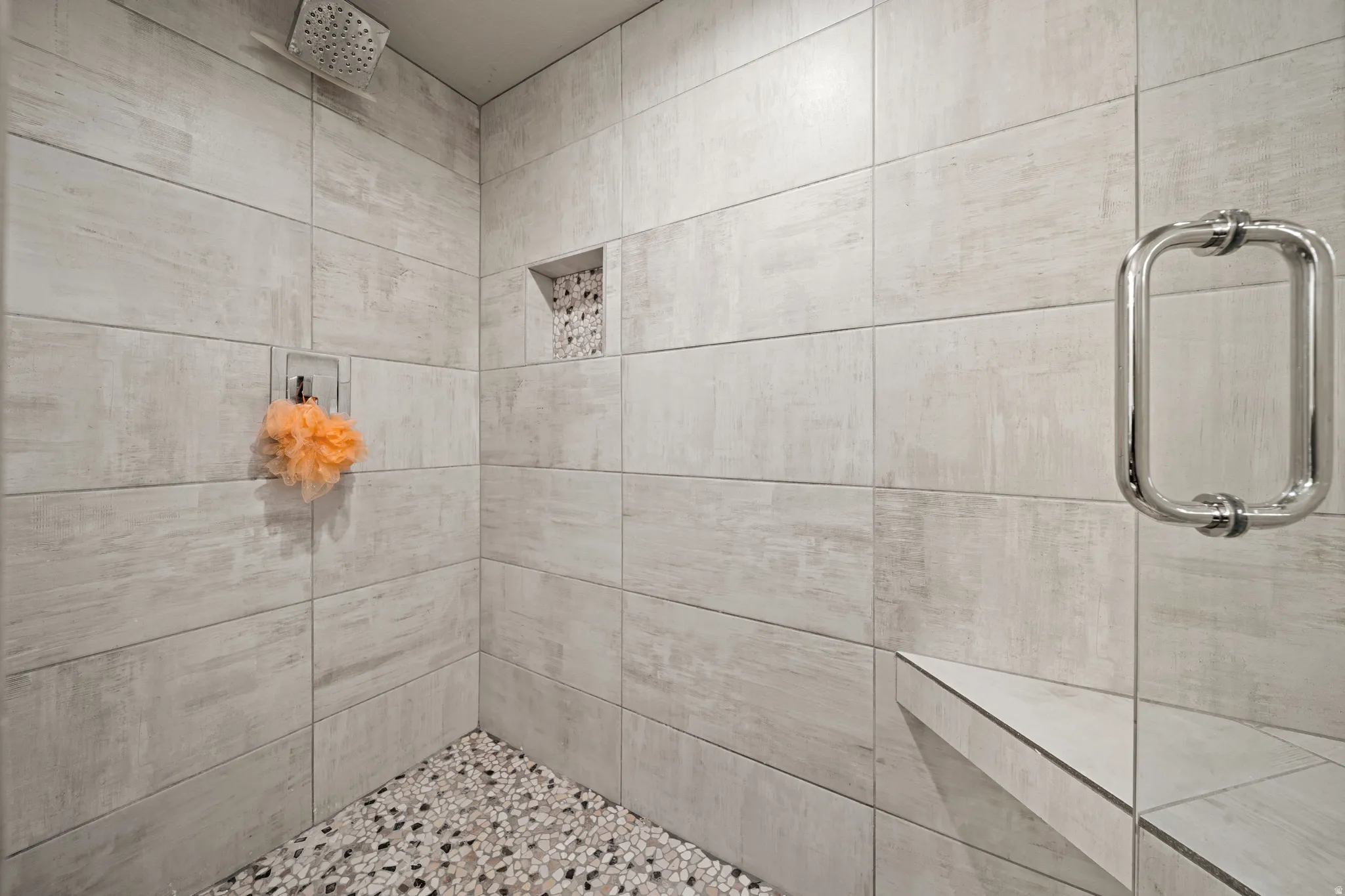 Full bath featuring a tile shower