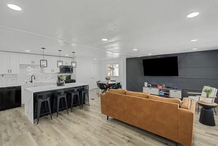 Living room featuring light wood-style floors and recessed lighting