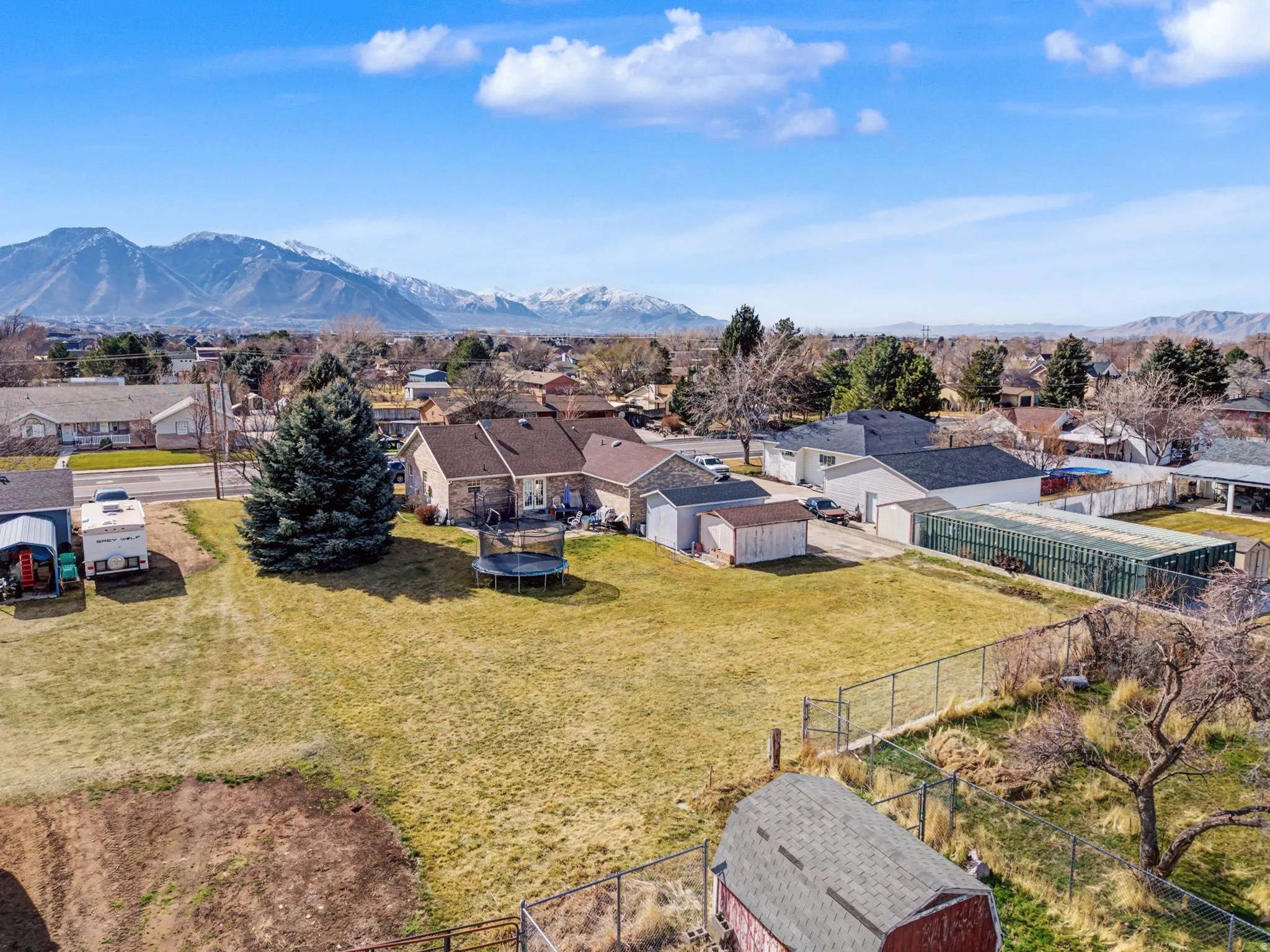 Aerial perspective of suburban area with a mountain backdrop