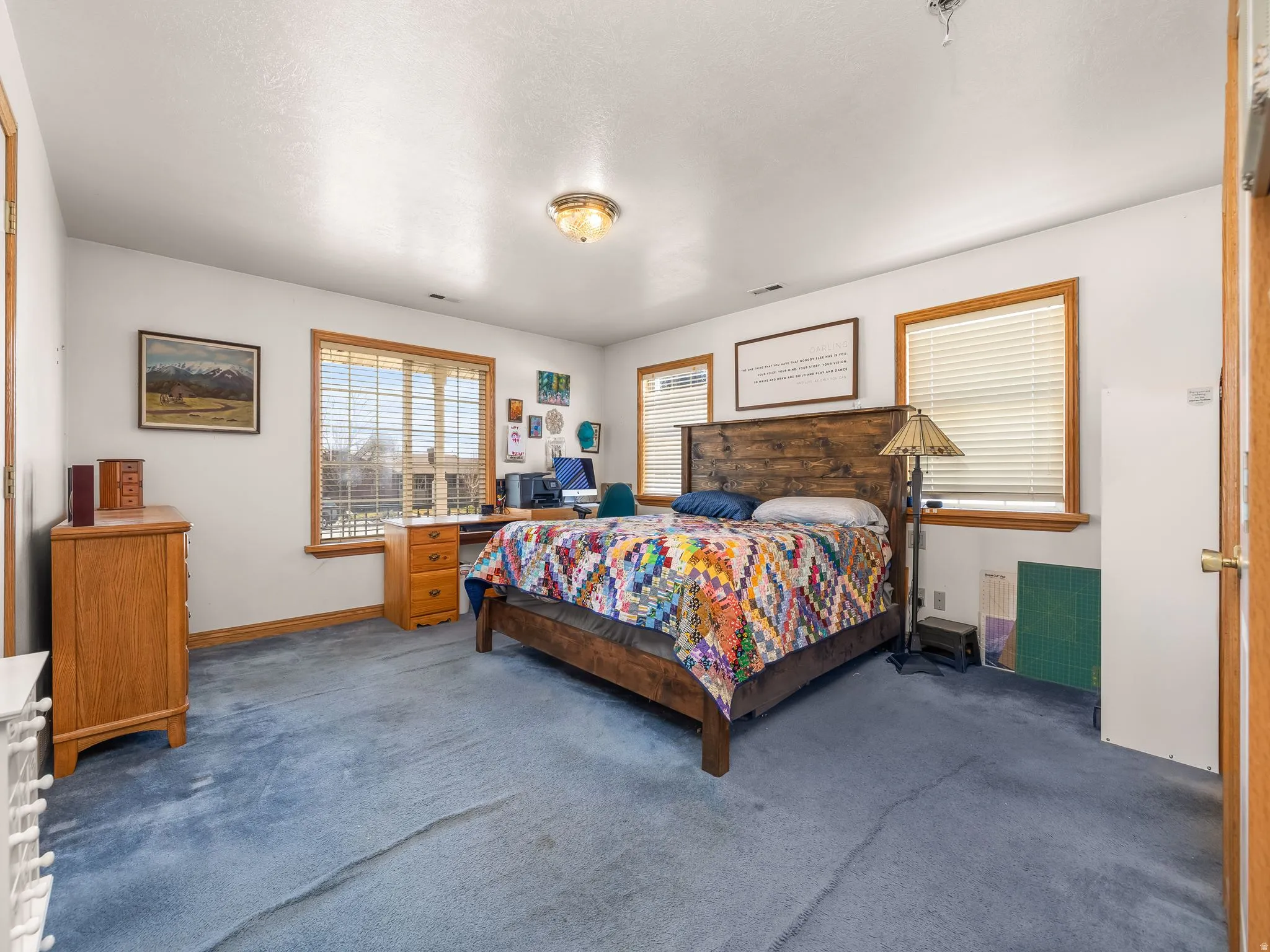 Carpeted primary bedroom featuring baseboards