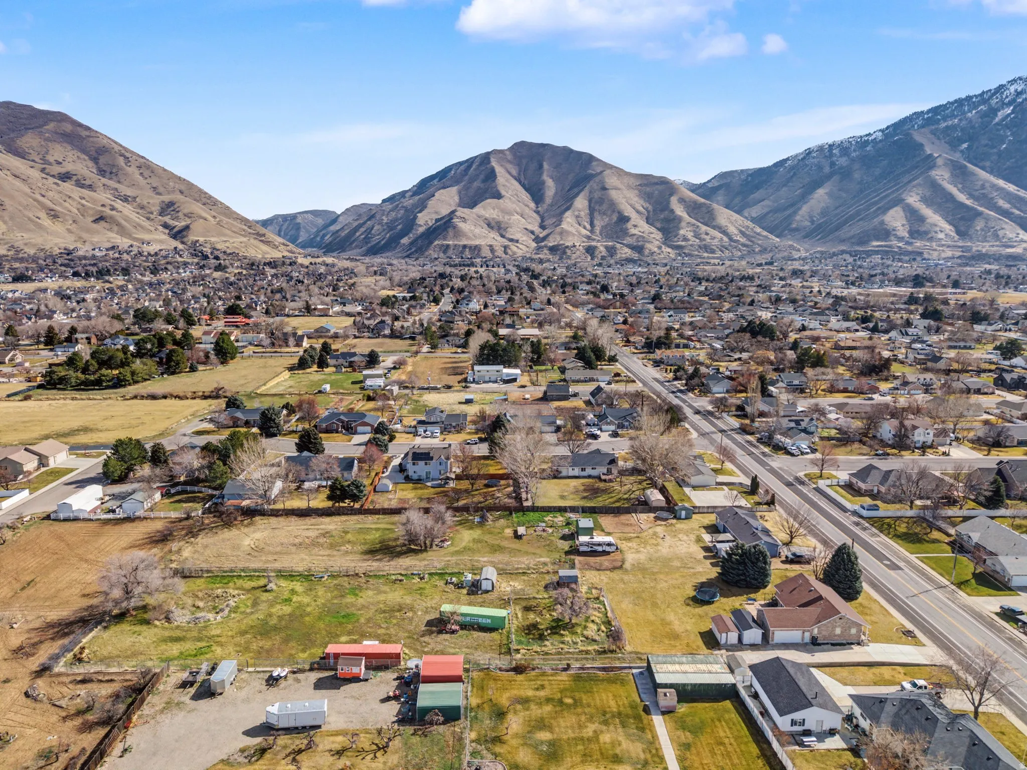 Aerial perspective of suburban area featuring a mountain backdrop