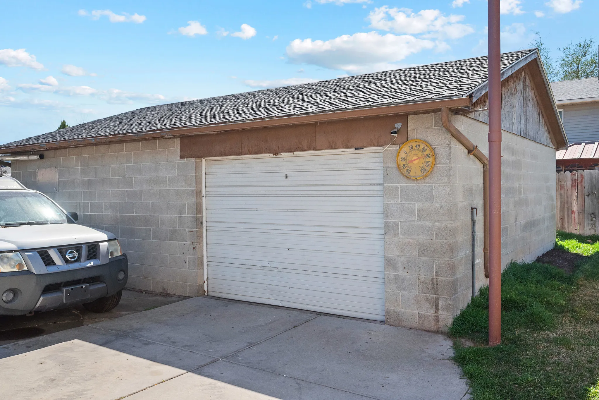 Detached garage featuring driveway