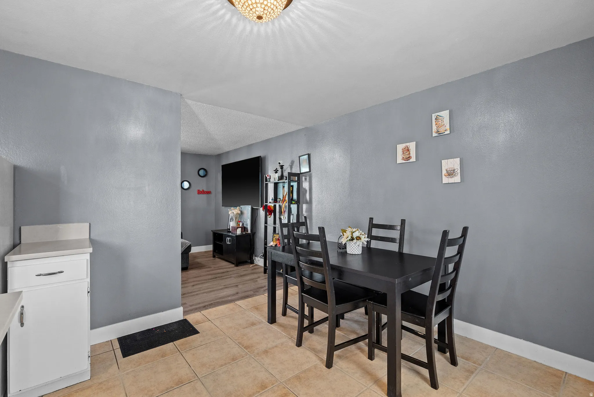 Dining room featuring baseboards and light tile patterned flooring