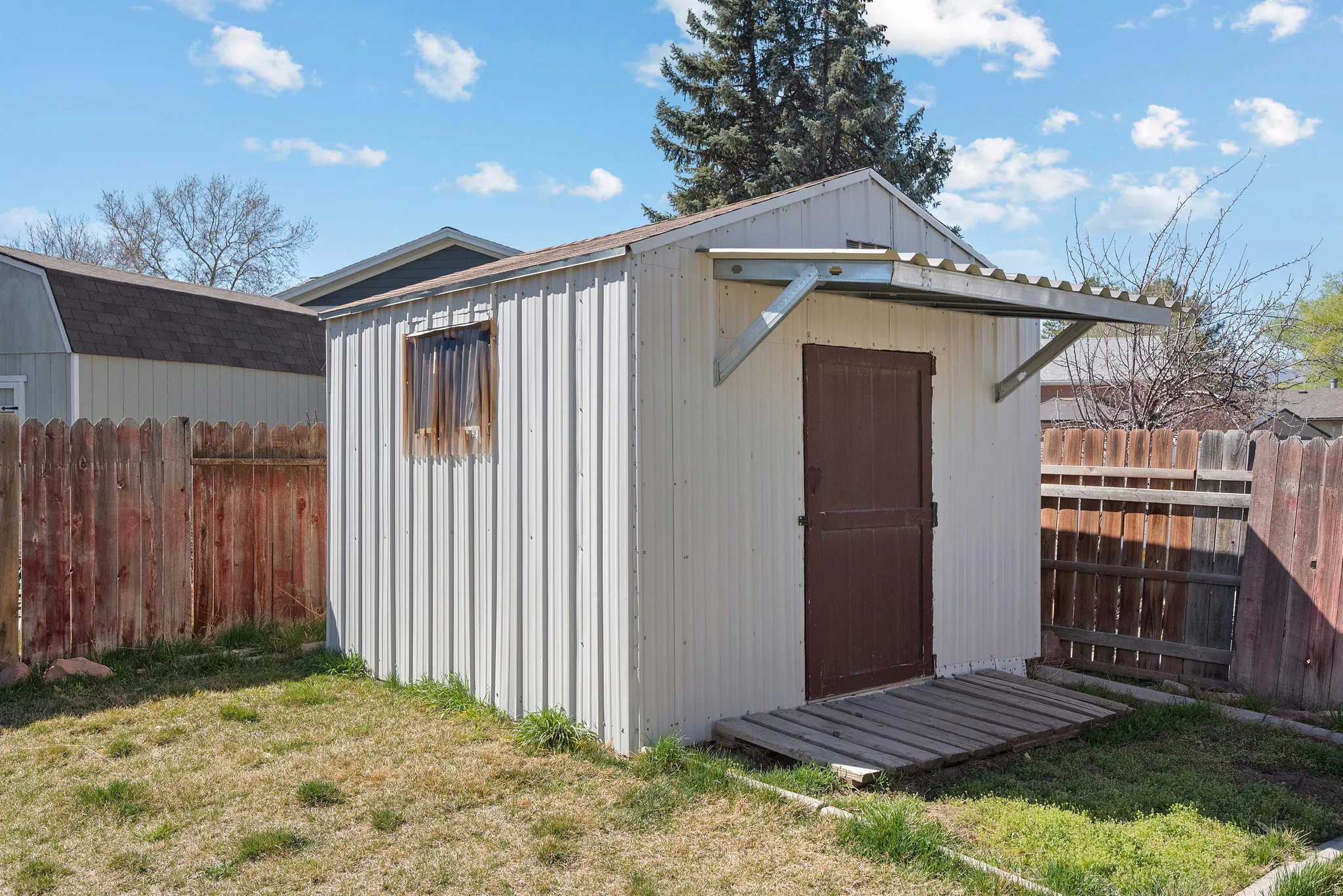View of shed with a fenced backyard