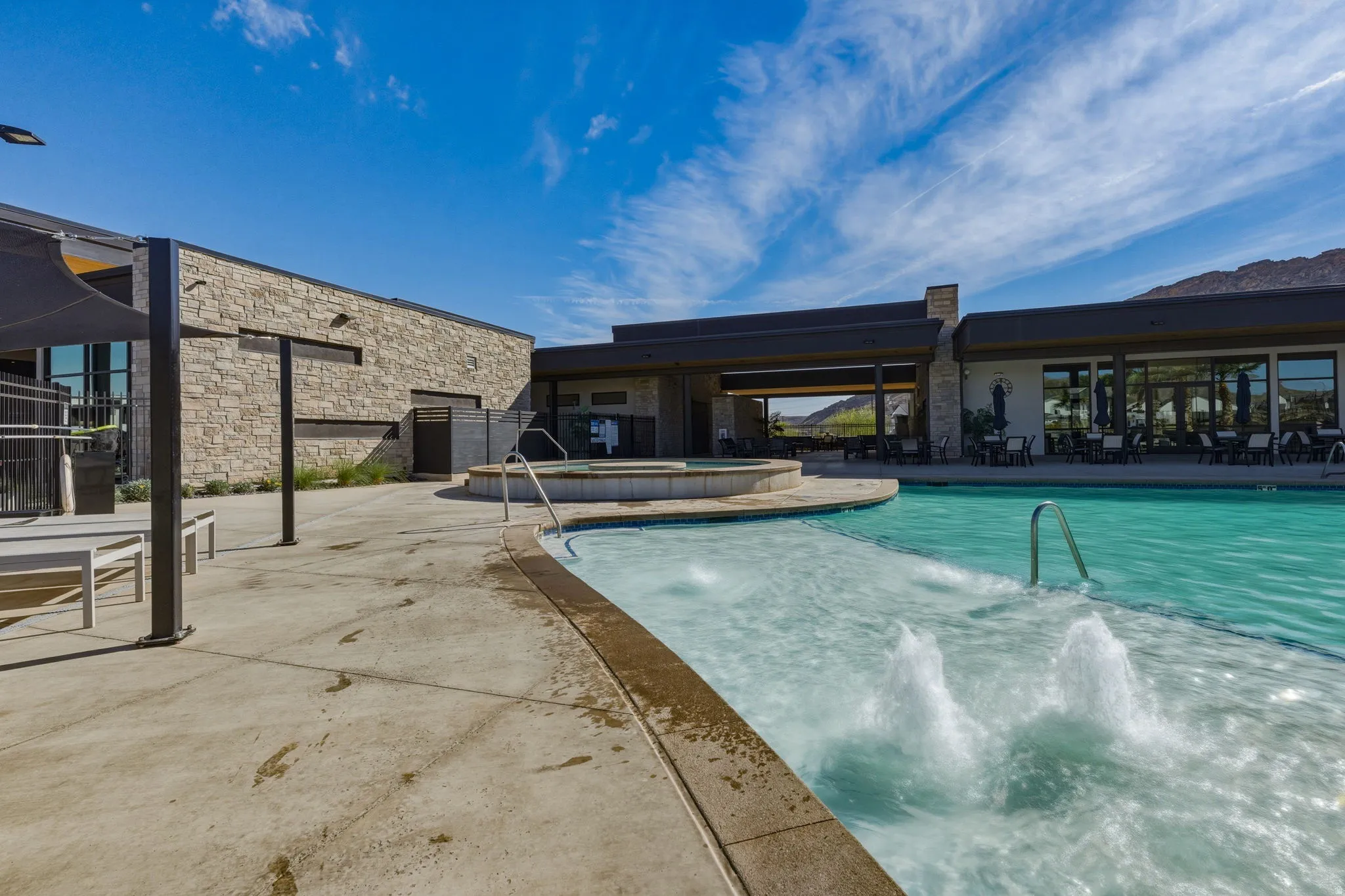 Community pool featuring a patio area