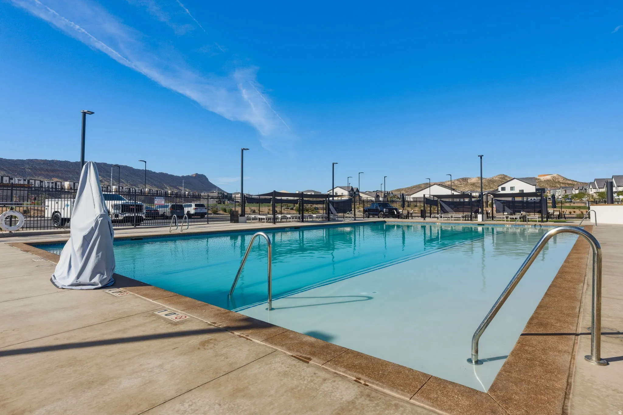 Community pool featuring a patio and a mountain view
