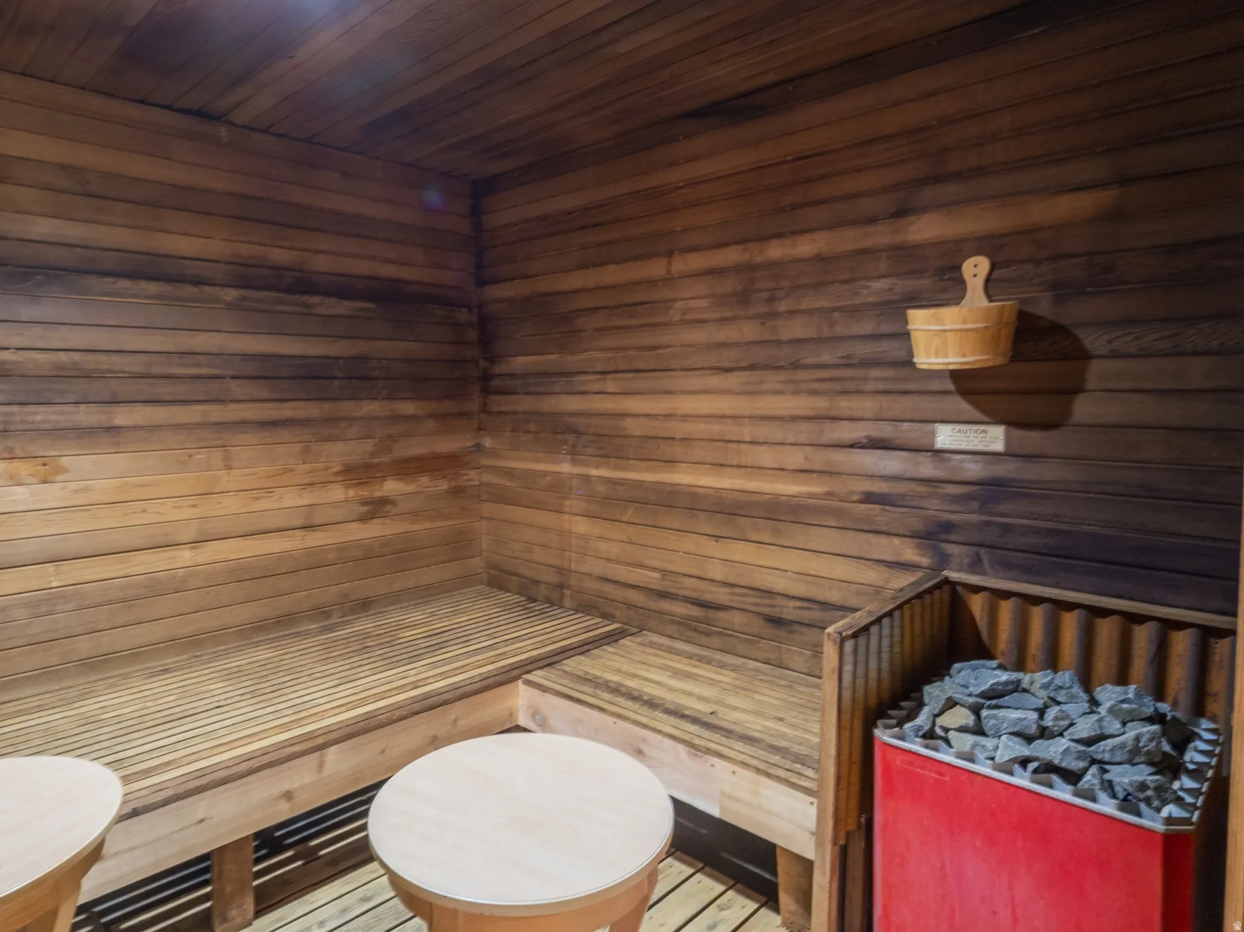 Relaxing sauna with wood ceiling and wooden walls