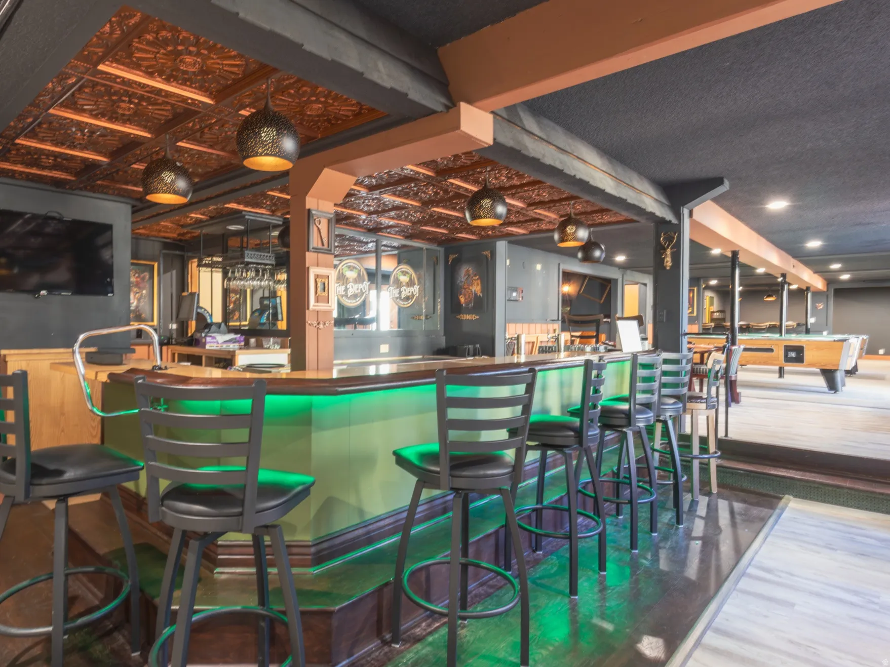 Community bar area with pool table and wainscoting