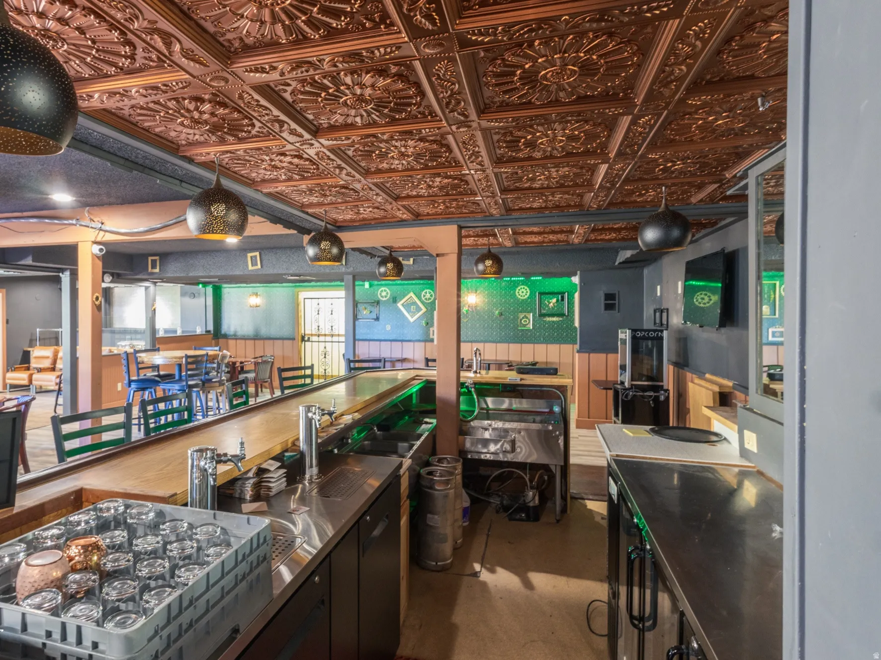 Kitchen with an ornate ceiling and stainless steel counters