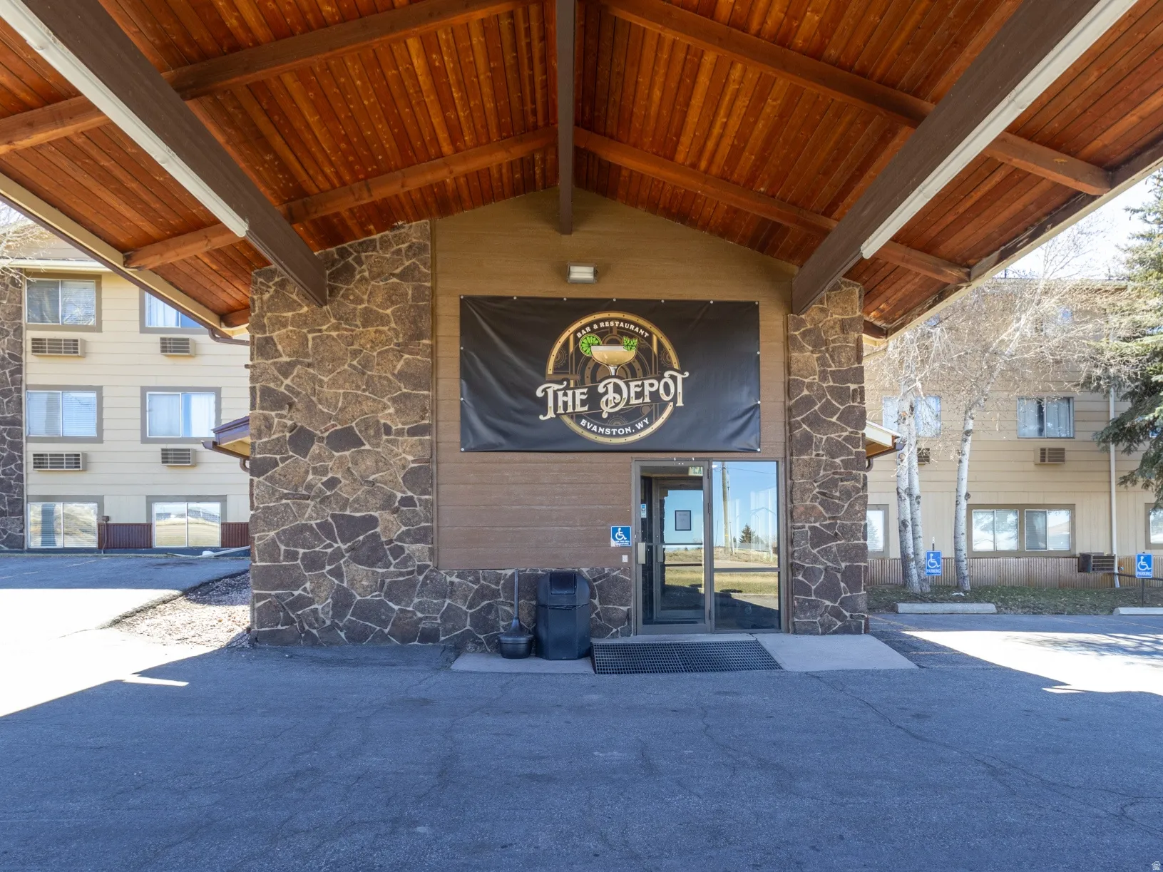 Property entrance with stone siding