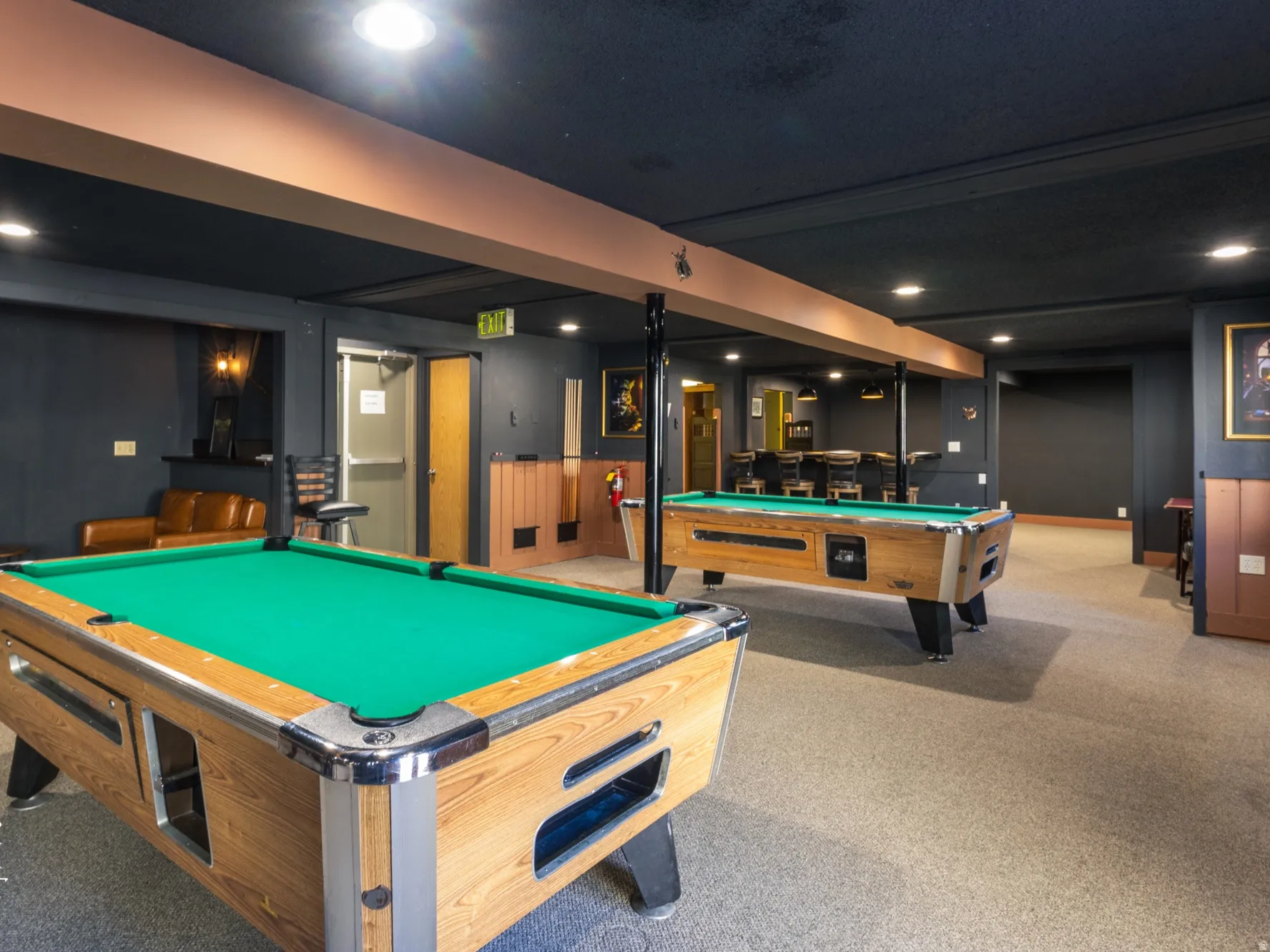 Recreation room with billiards and recessed lighting