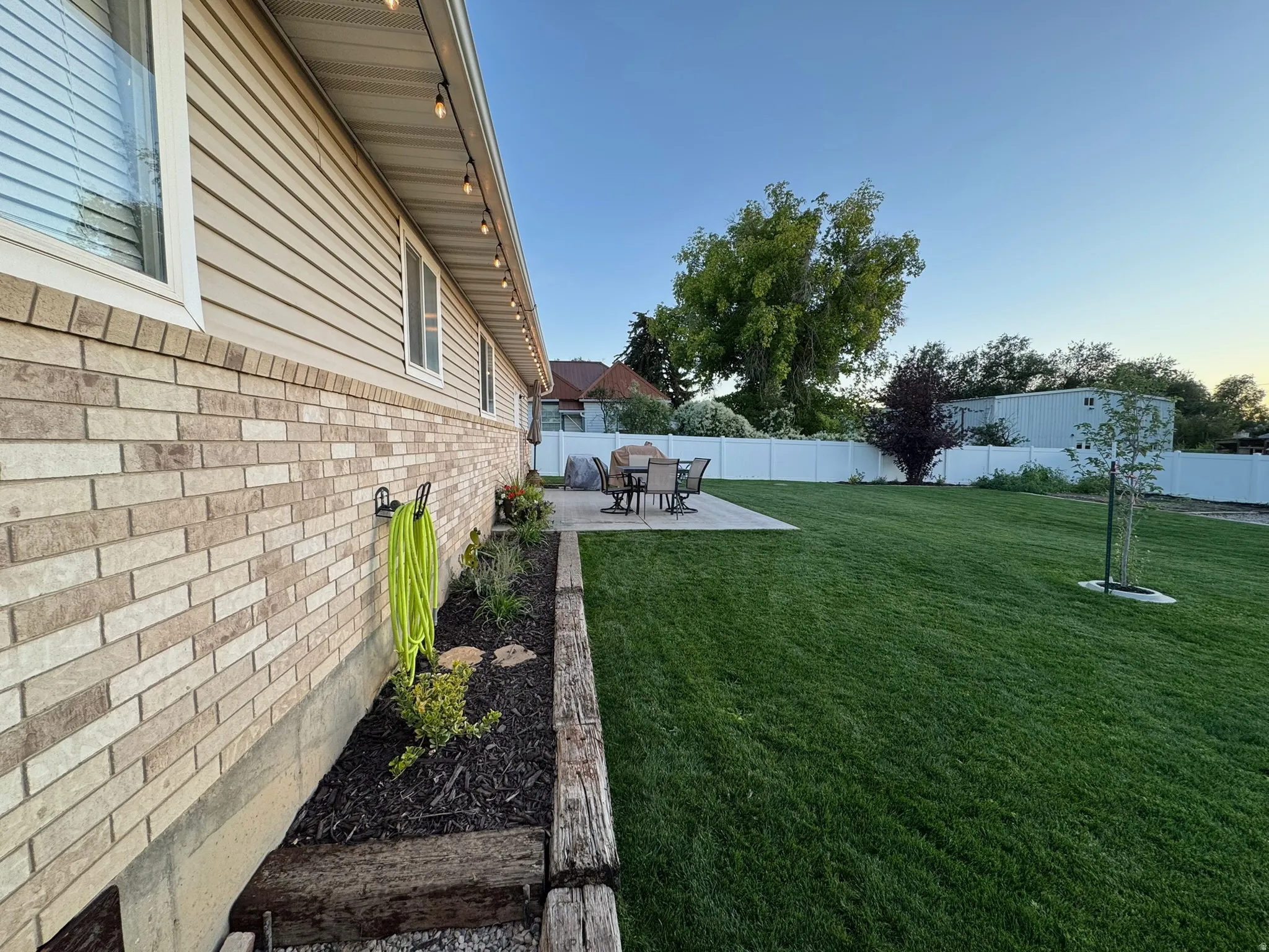 Fenced backyard featuring a patio area