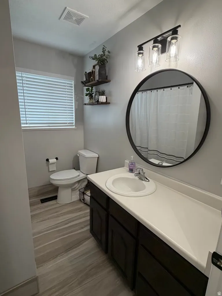 Bathroom featuring vanity and a shower with shower curtain