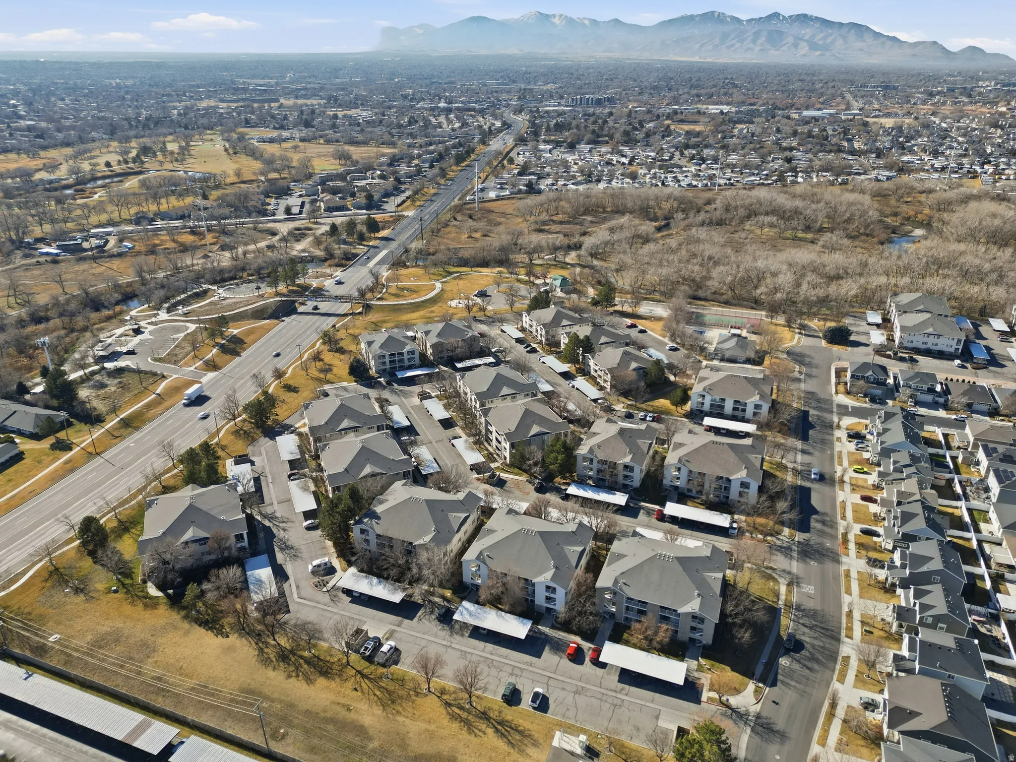 View of property location featuring nearby suburban area and a mountainous background