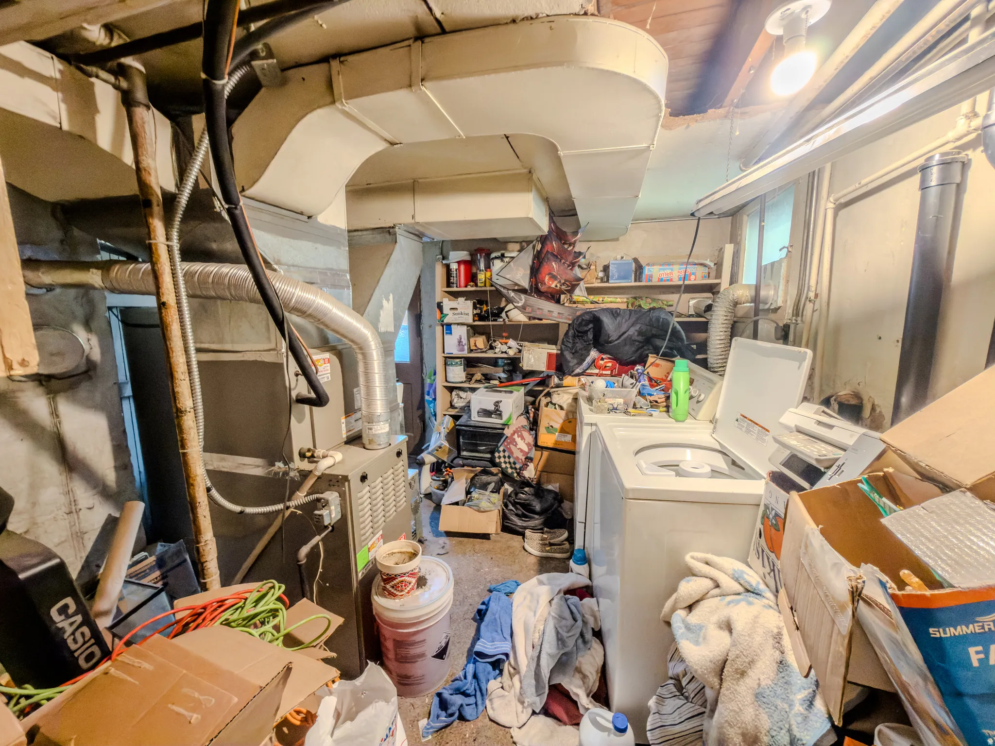 Basement with heating unit and independent washer and dryer