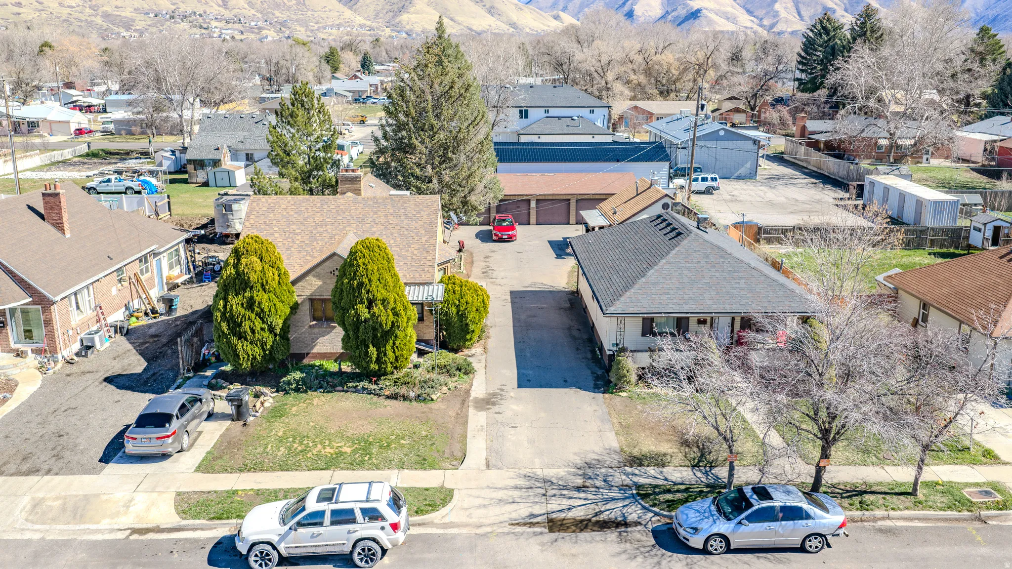 Aerial view of residential area featuring a mountain backdrop