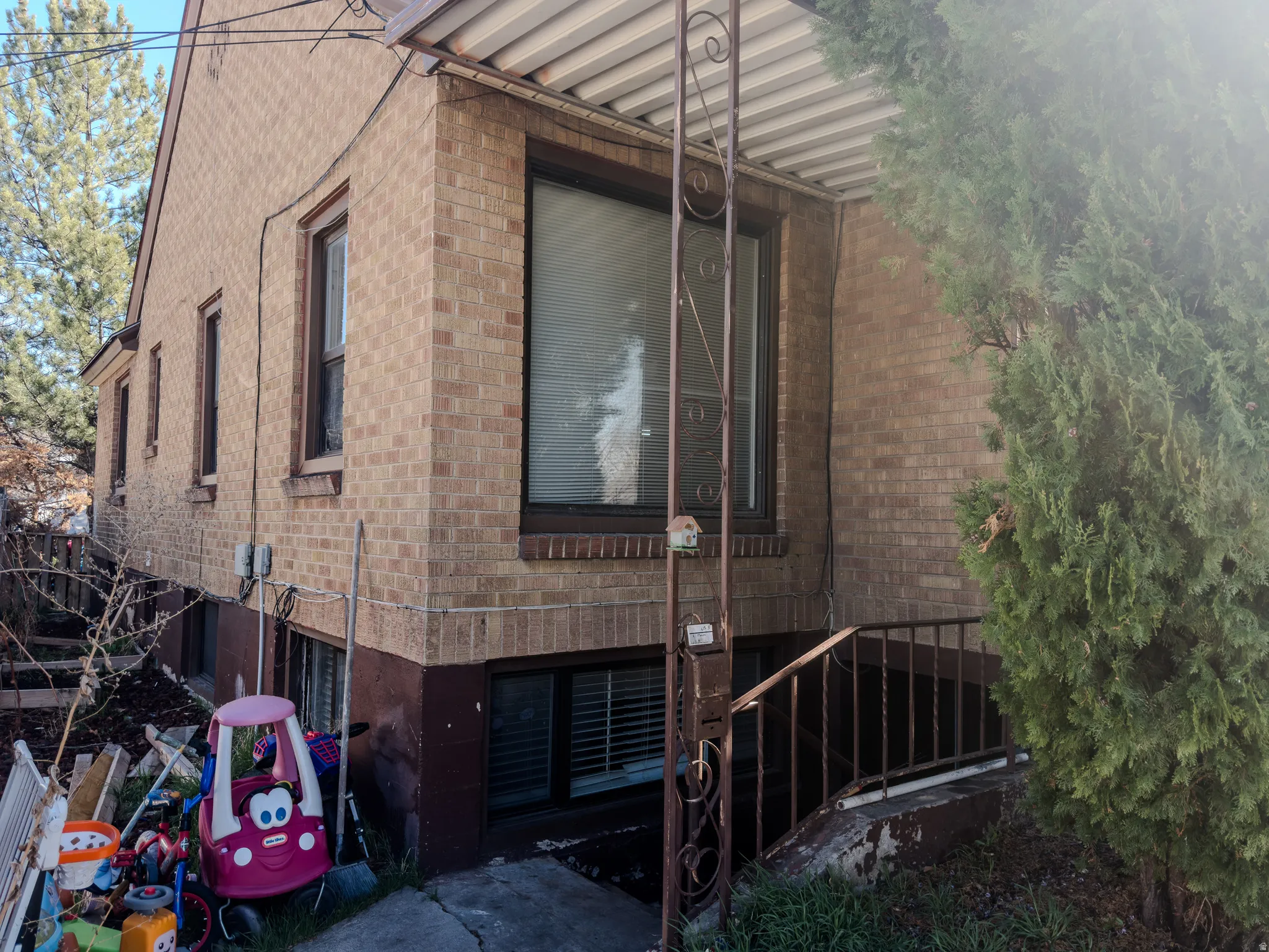 View of property exterior featuring brick siding