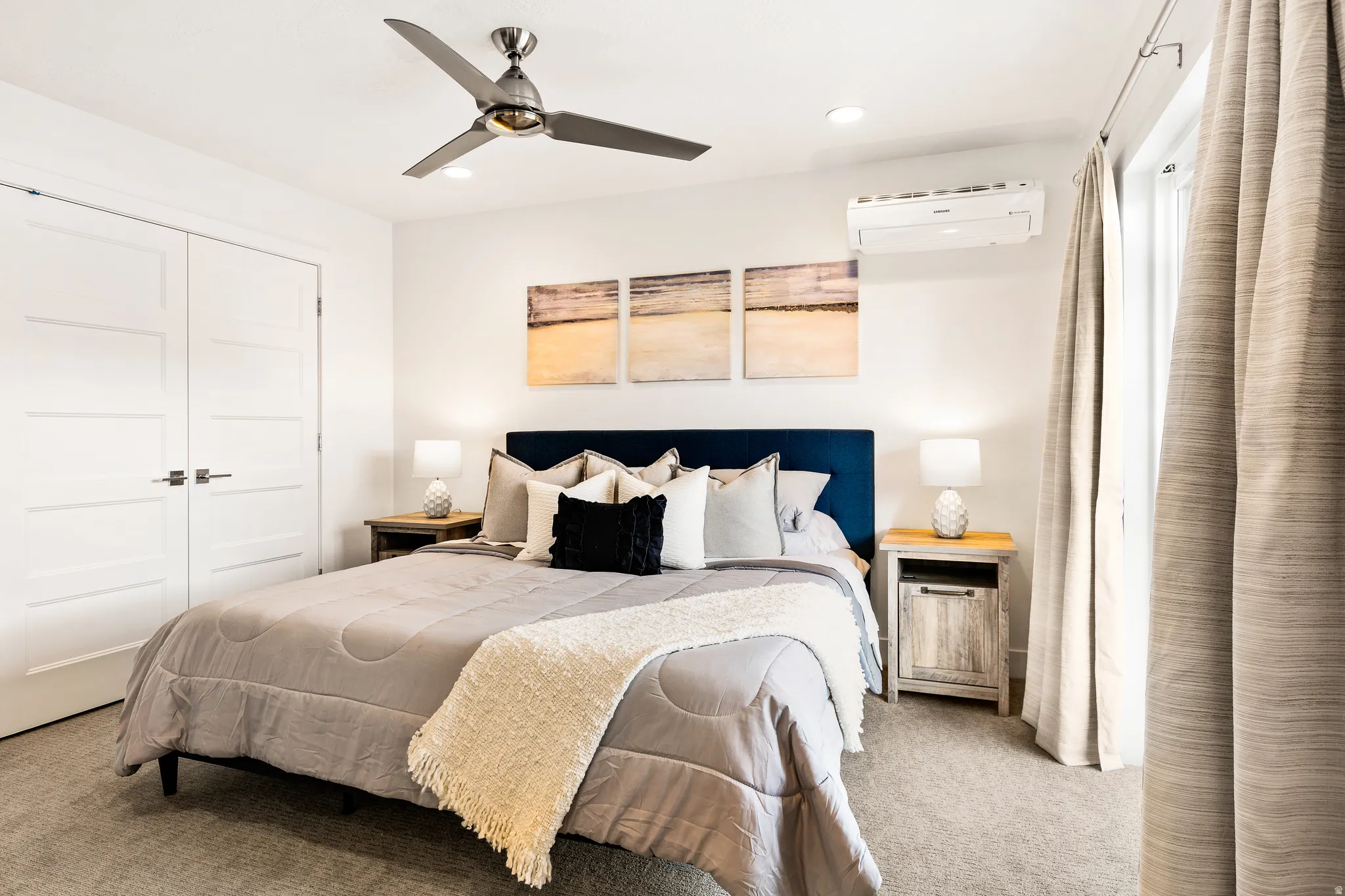 Carpeted bedroom with a closet, a ceiling fan, and recessed lighting