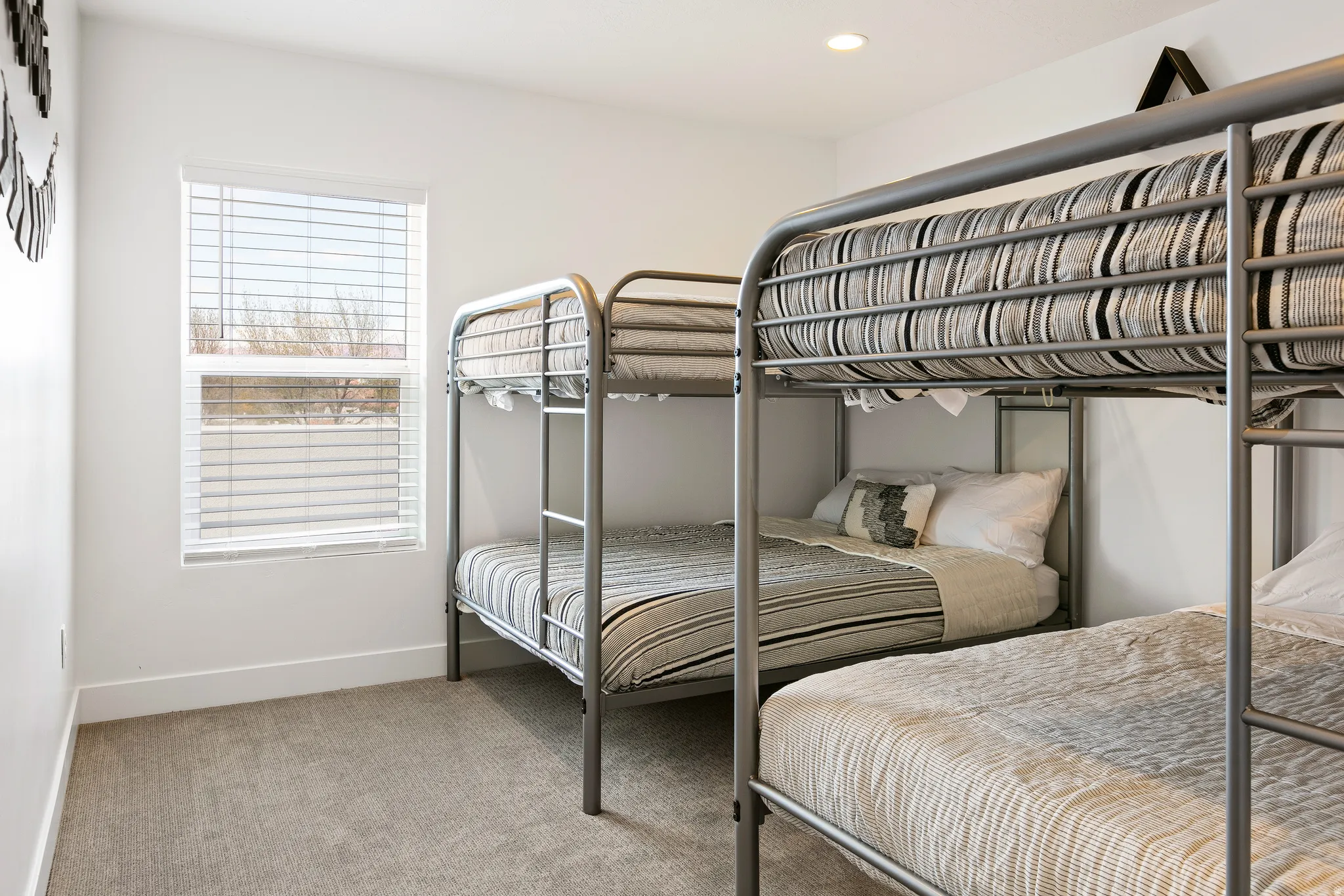 Bedroom featuring light colored carpet and recessed lighting