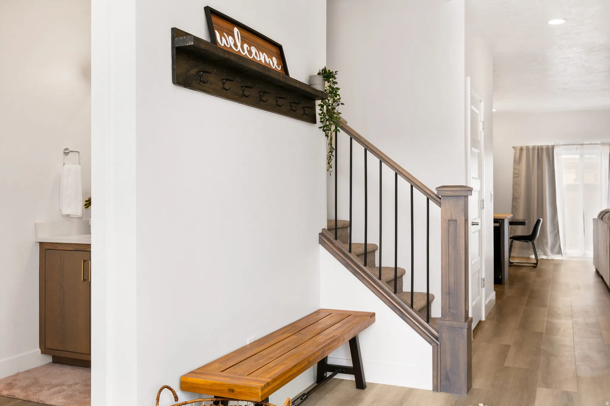 Stairs featuring baseboards and wood finished floors