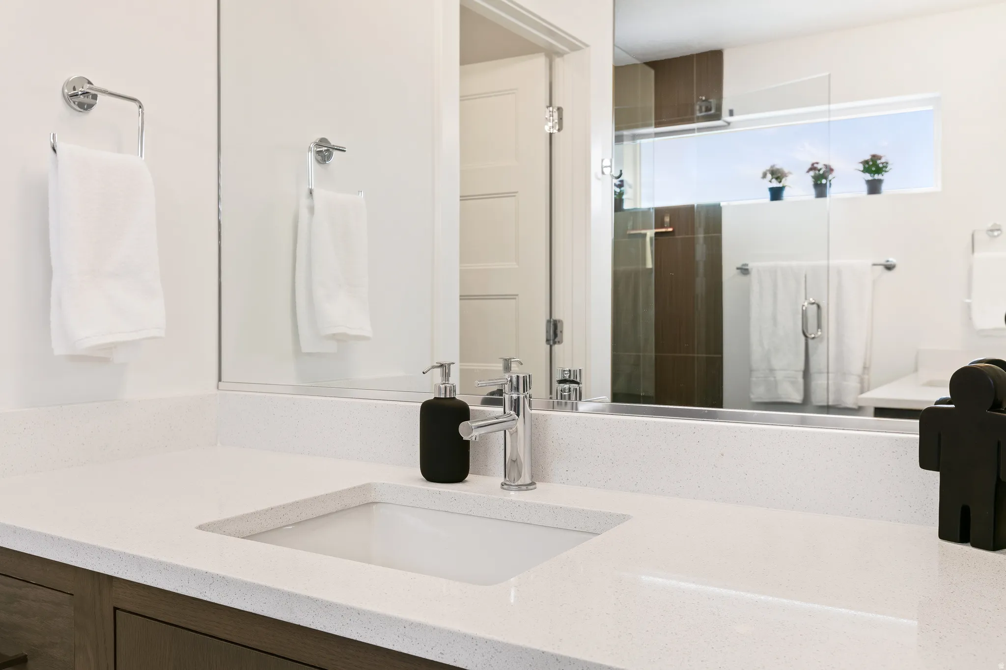 Full bathroom with vanity and a shower stall