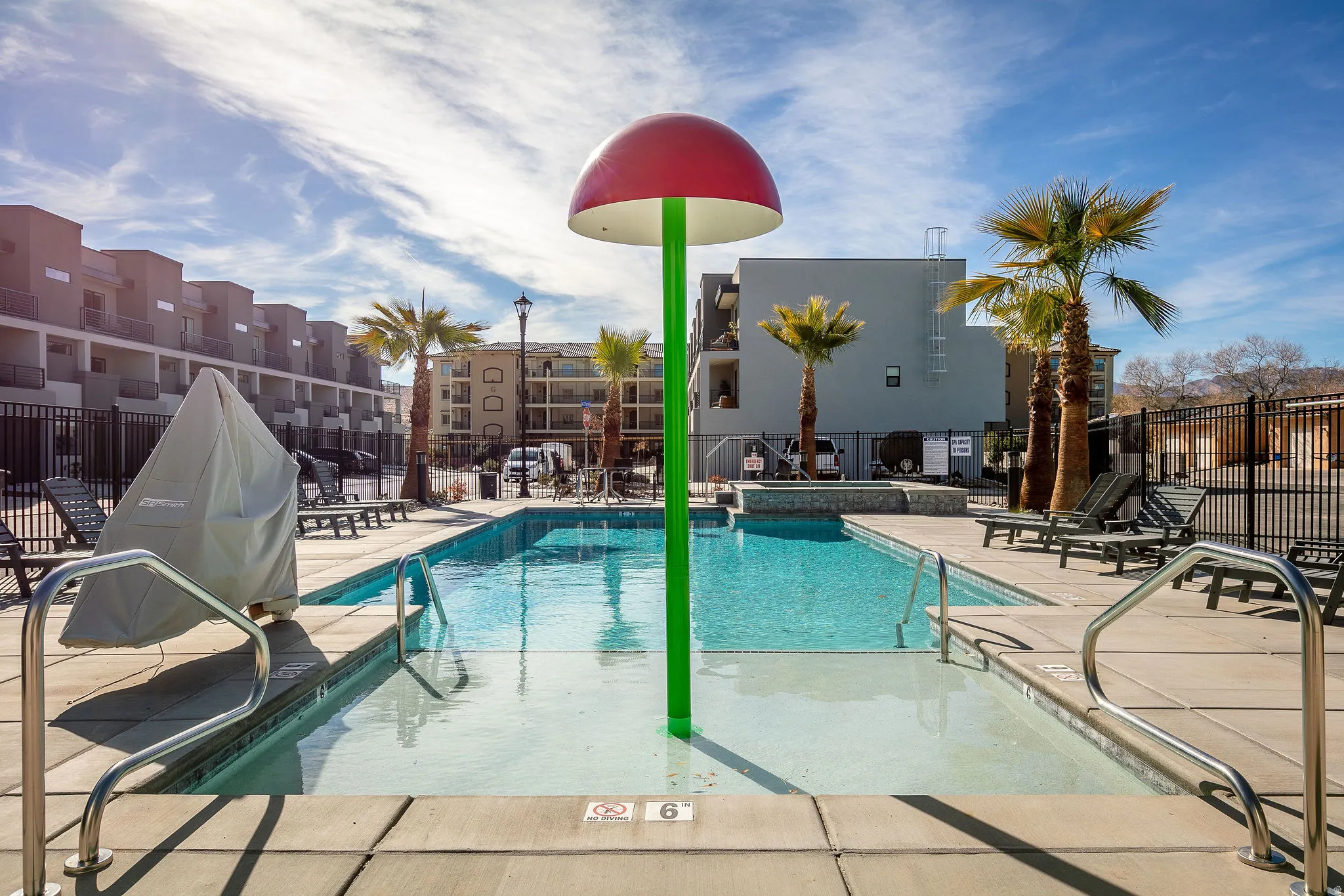 Community pool with a patio area