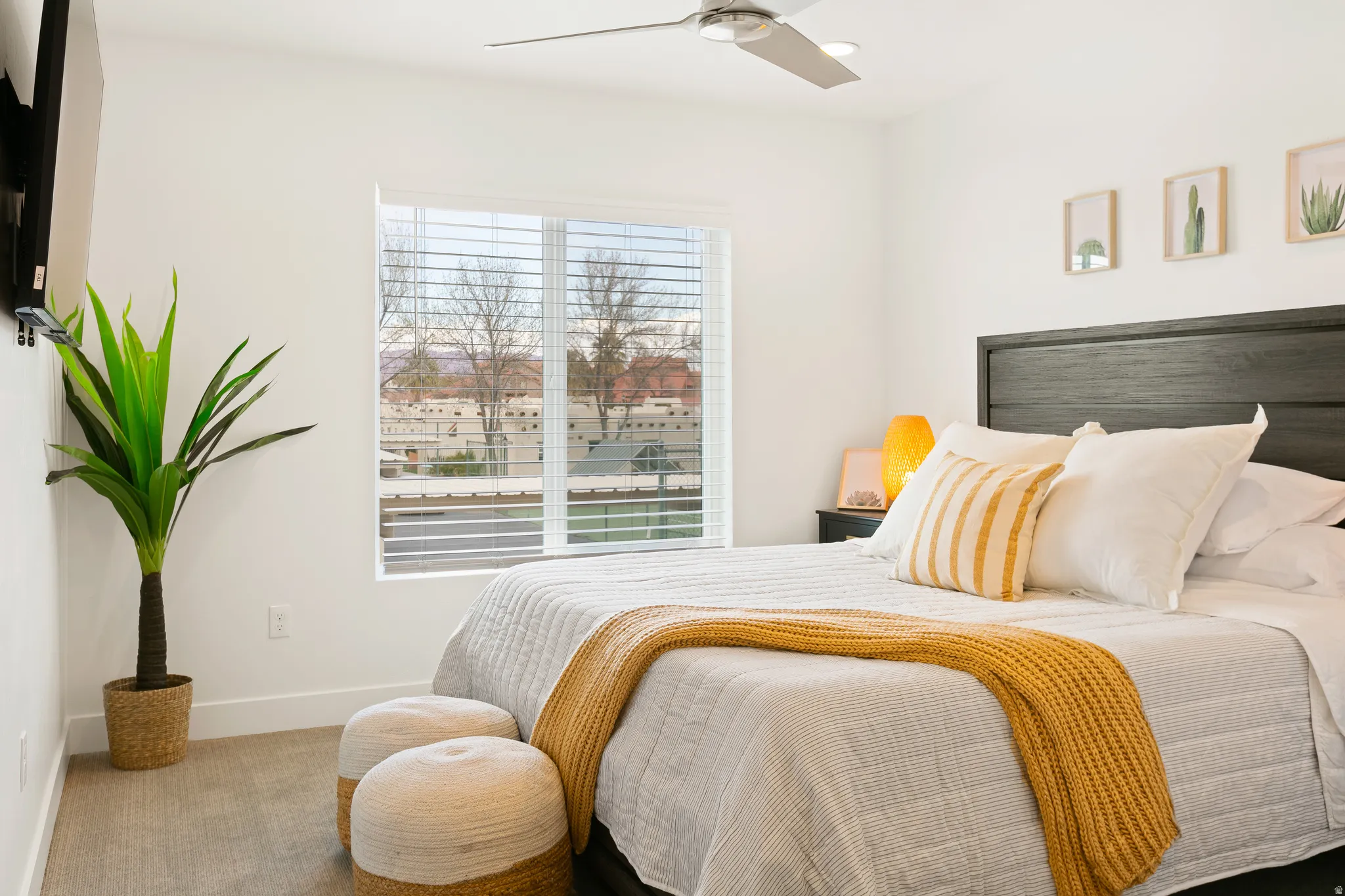 Bedroom featuring carpet and ceiling fan