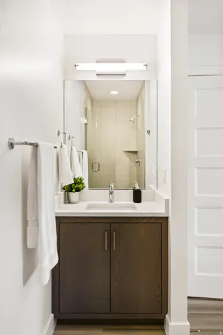 Full bathroom featuring a shower stall and vanity