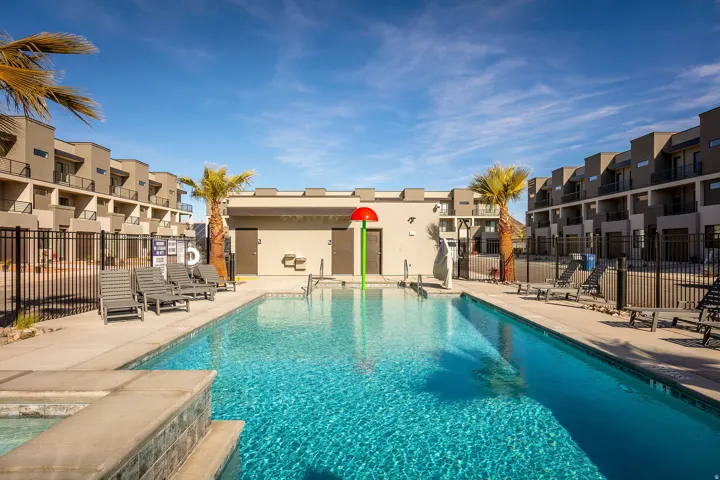 Community pool with a patio area