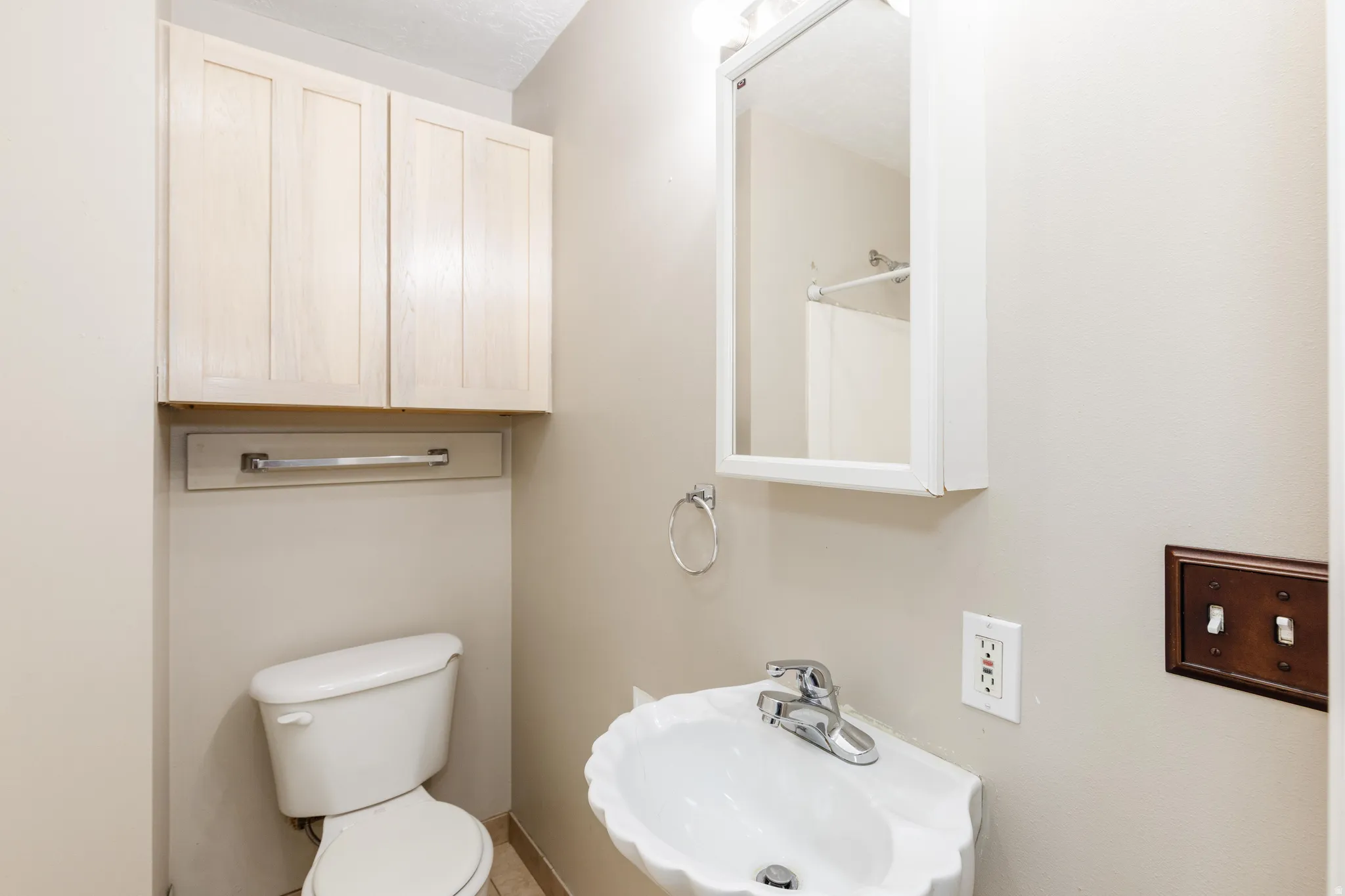 Bathroom with toilet and a sink