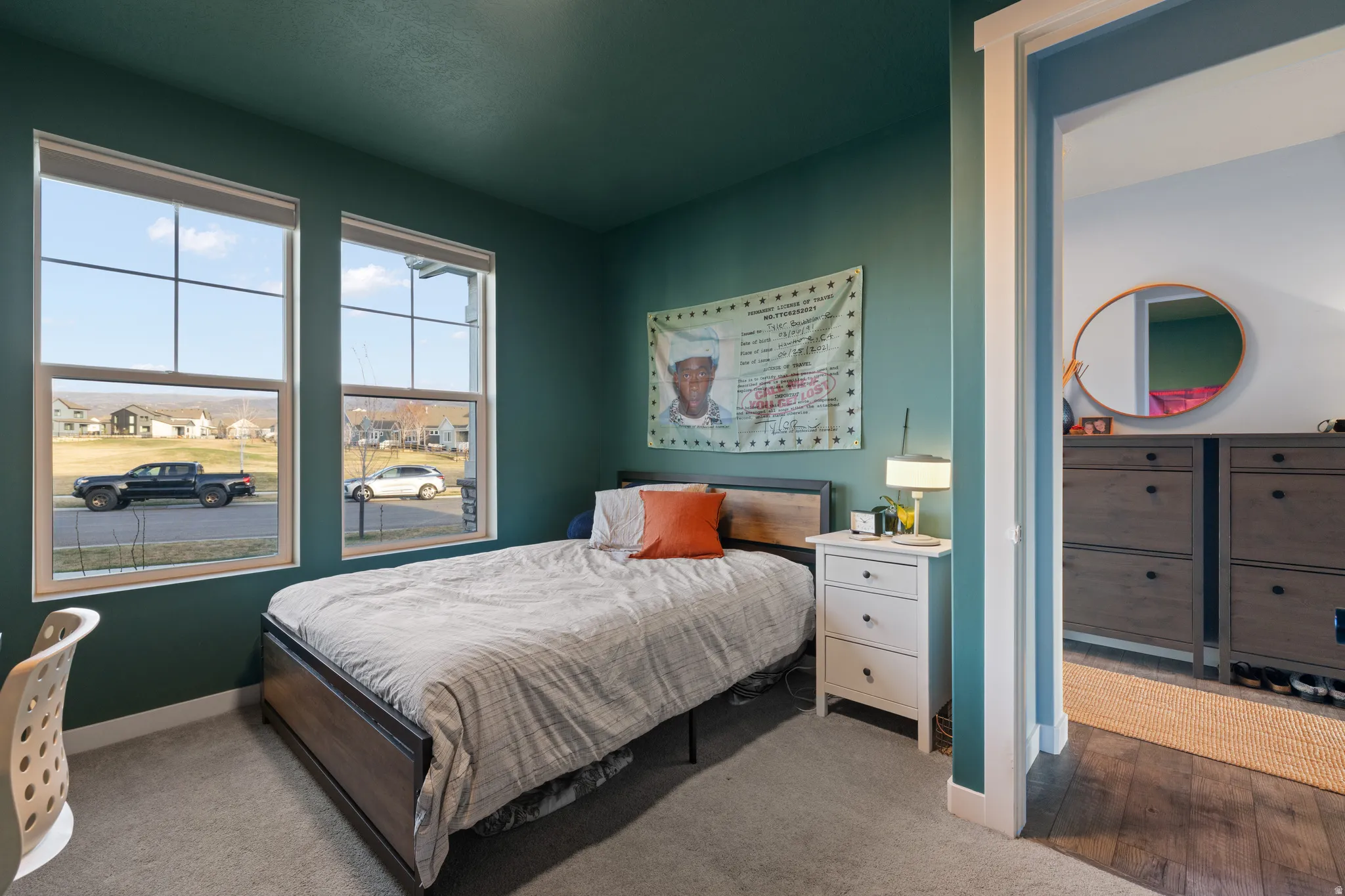Bedroom featuring carpet floors and baseboards