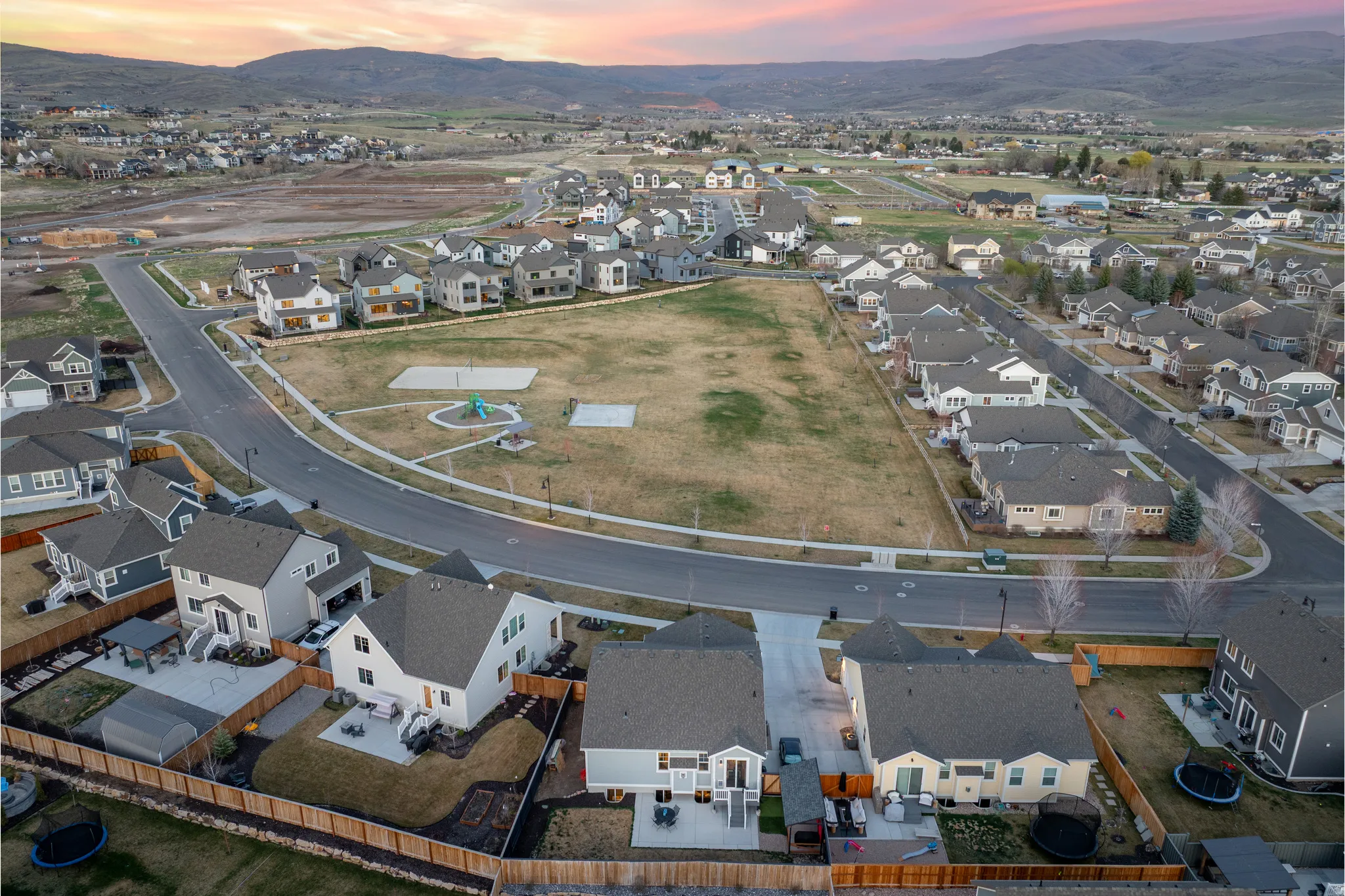 Aerial view at dusk of a residential view and a mountain view