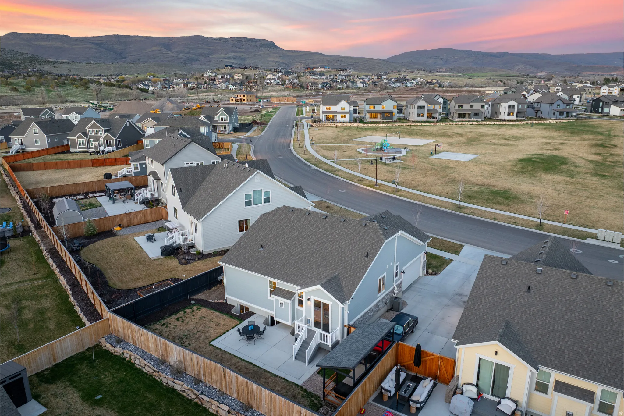 Aerial view at dusk of a residential view and a mountain view