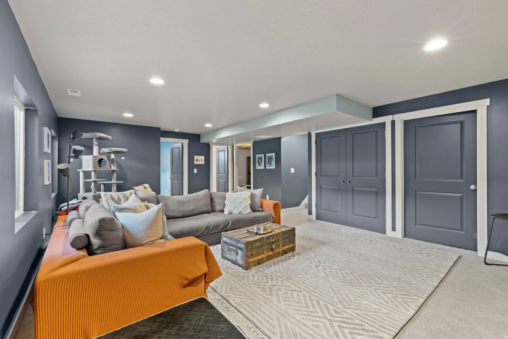 Carpeted living room featuring recessed lighting