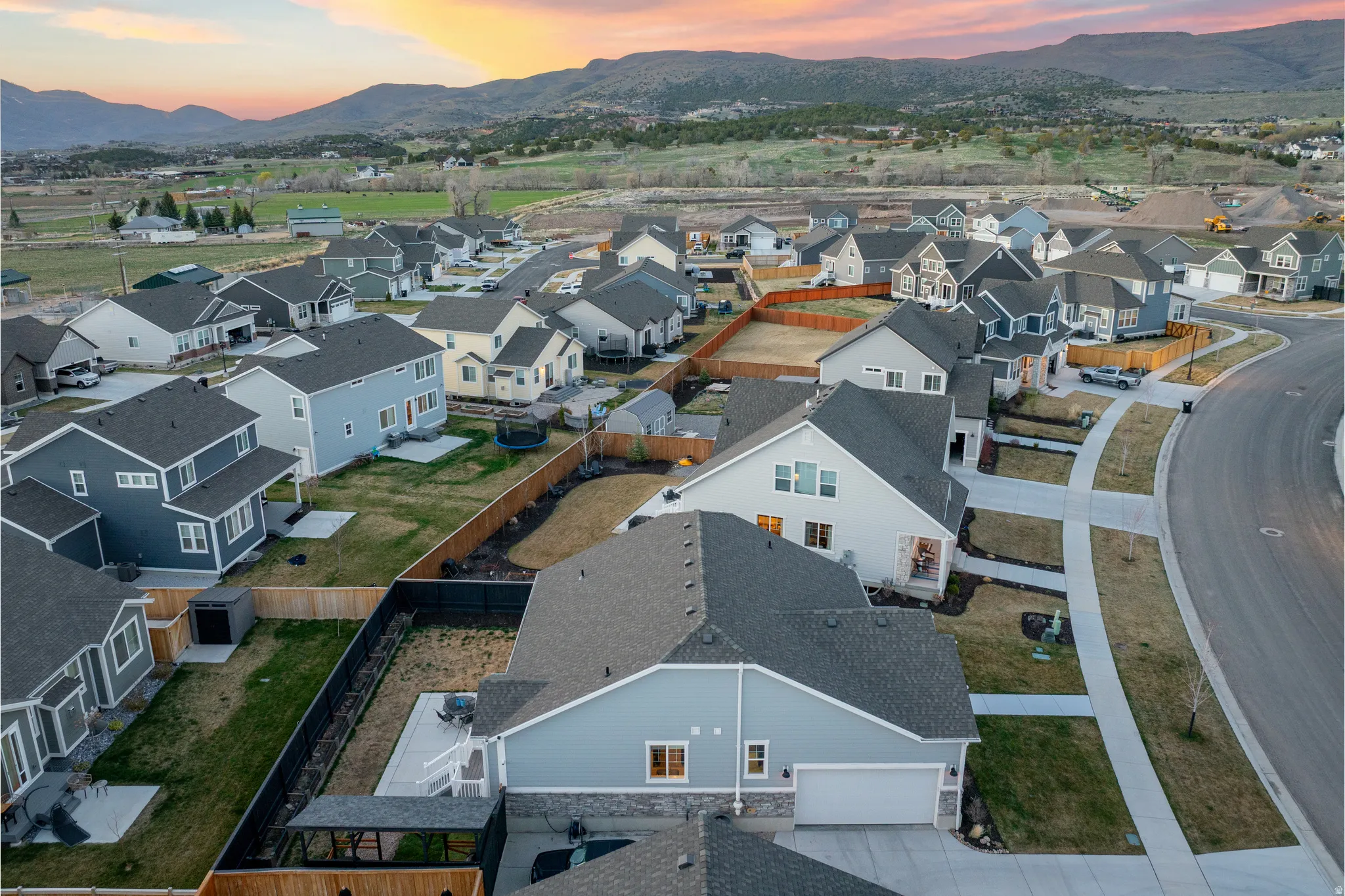 Aerial view at dusk of a mountain view and a residential view
