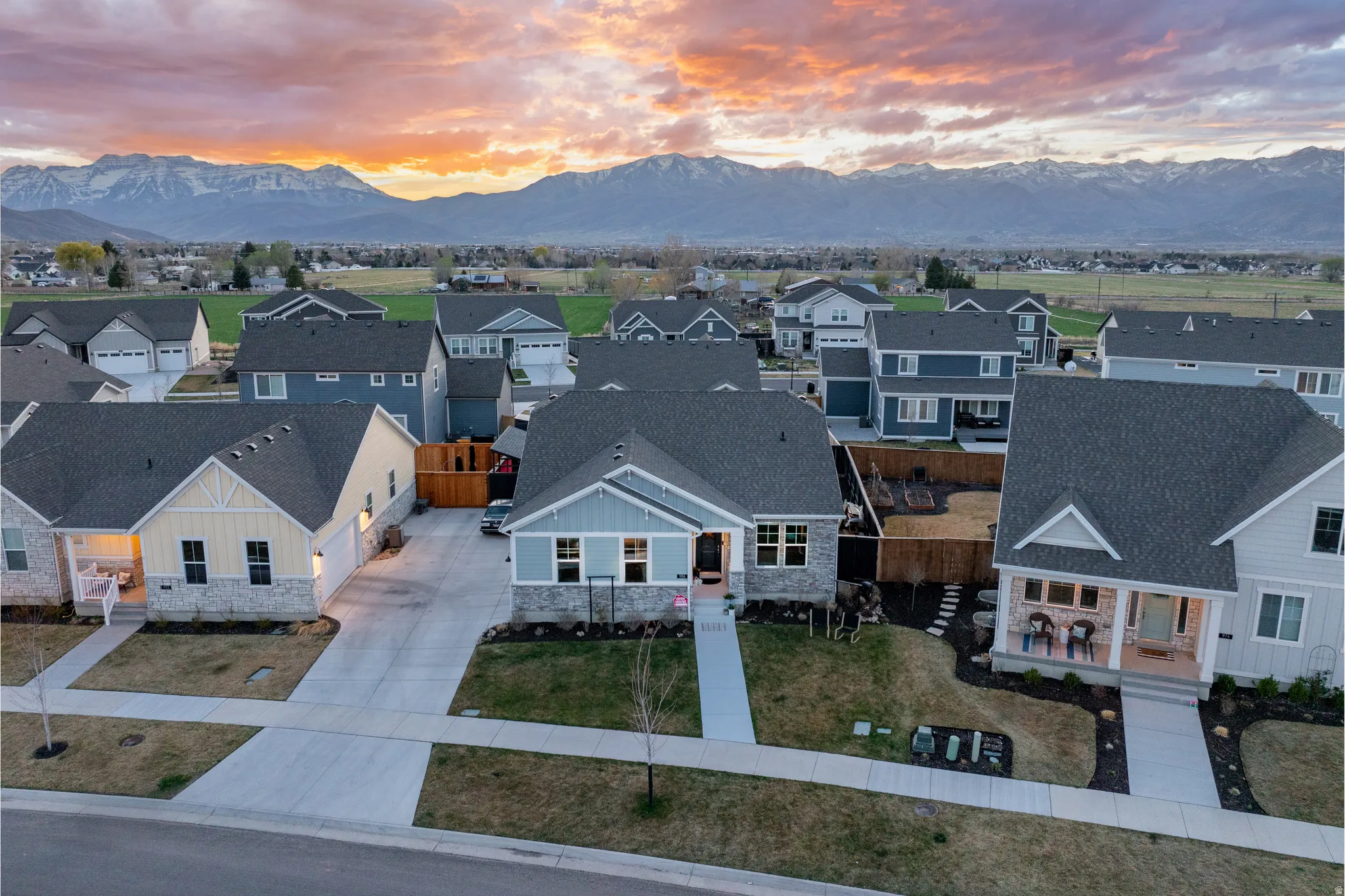Aerial view of residential area featuring a mountainous background