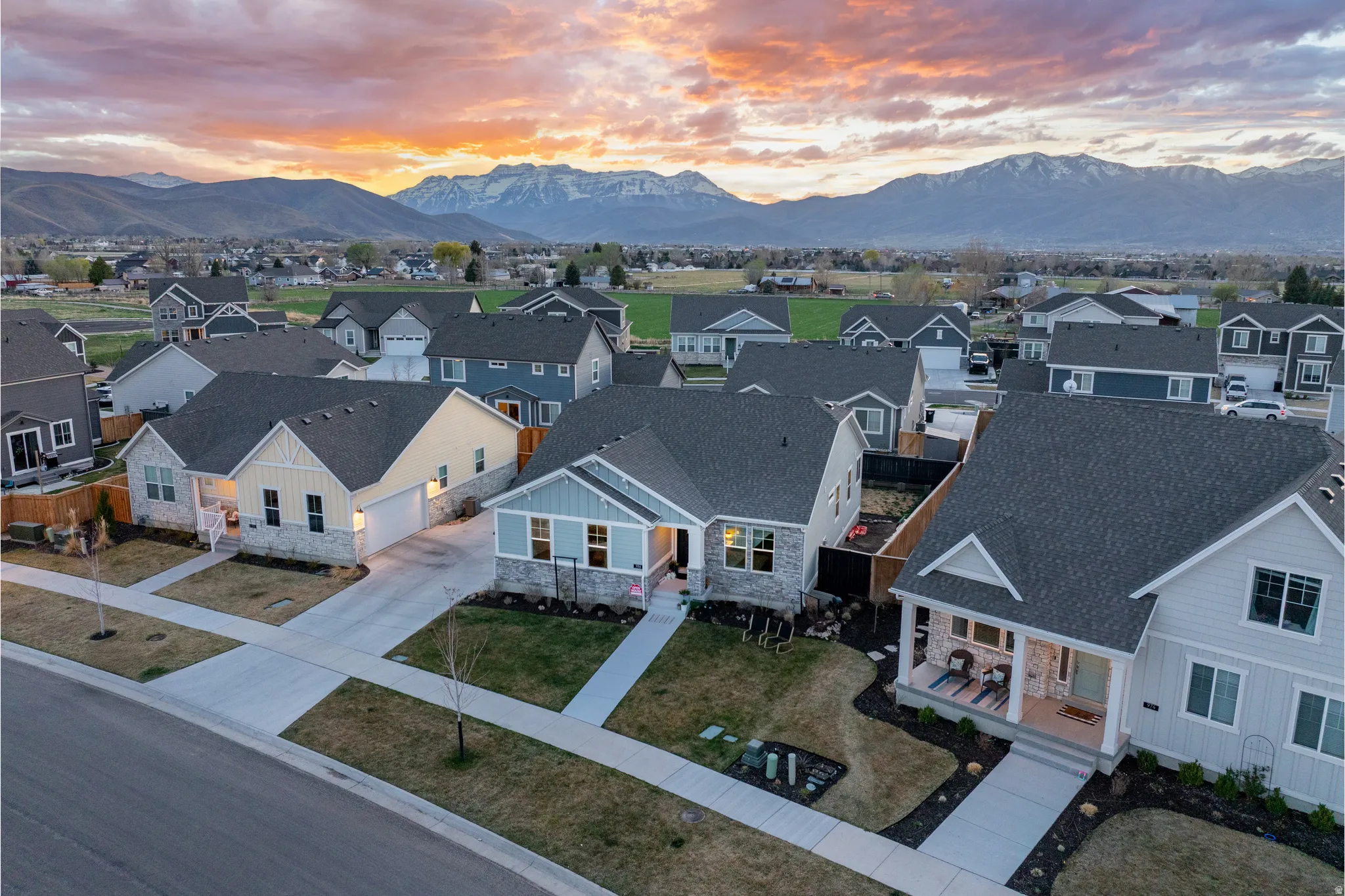 Aerial view at dusk of a residential view and a mountain view