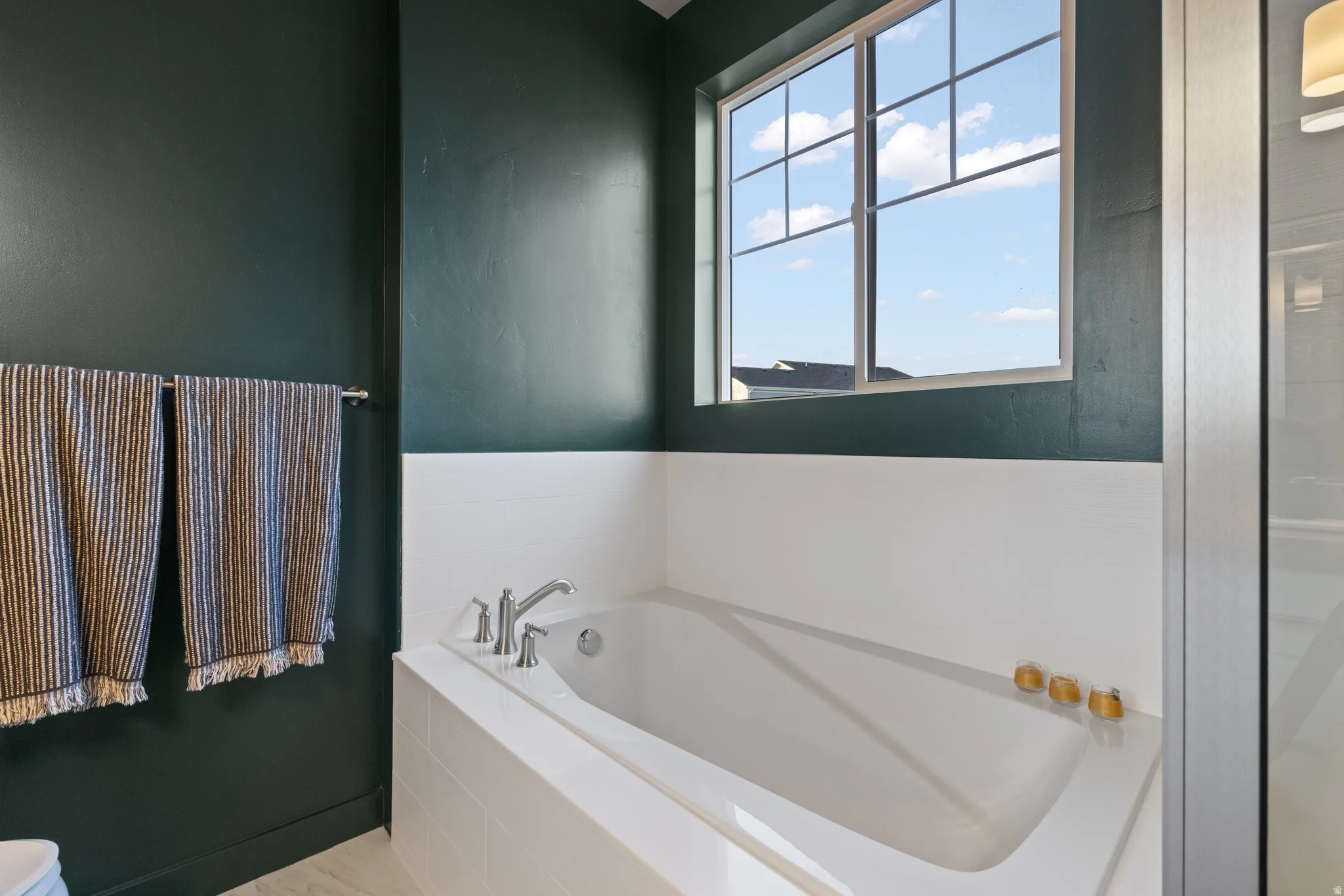 Full bathroom with a garden tub