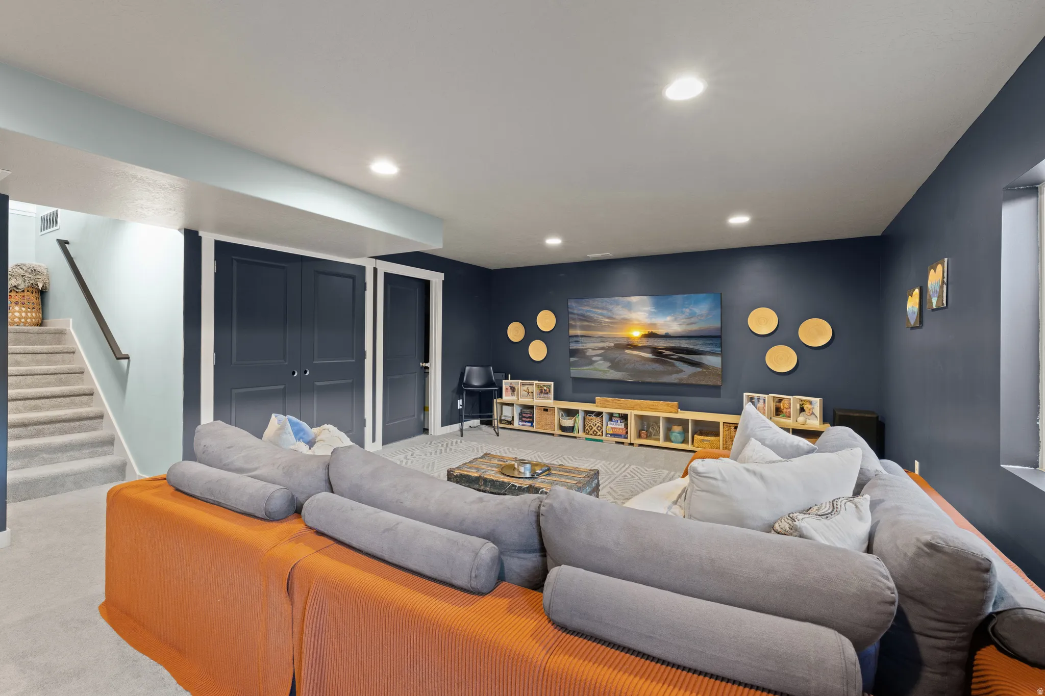 Living area featuring carpet floors and recessed lighting